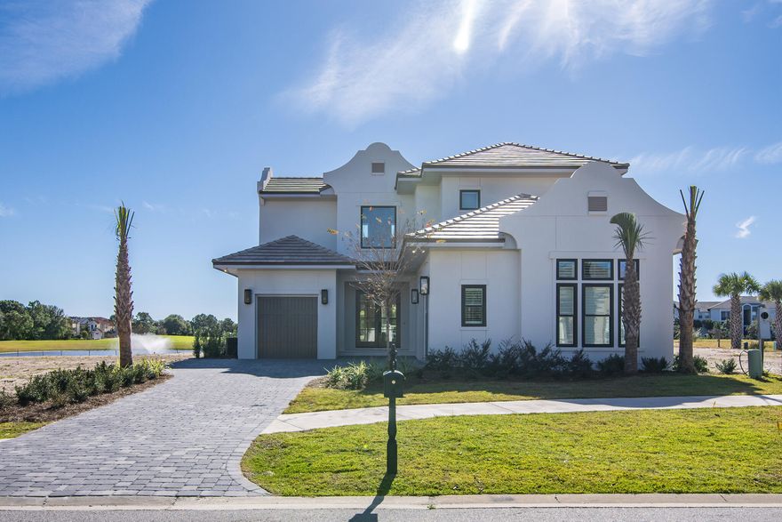 Introducing this beautiful lakefront, and only one year old, 4 br, 4 full/2 half ba. residence within the new Tradewinds community in Regatta Bay in Destin! This home reflects the epitome of luxury living with unique features and refined design. With a West Indies architectural style infused with Dutch influences, this residence exudes modern sophistication. The carefully chosen designer finishes bring an exclusive touch to the home and seamlessly blends practical features with a touch of elegance. This residence embodies a balance of modern technology, quality craftsmanship, and thoughtful design. With the beautiful view, open floorplan, 3 car garage, pool, 4br's, high end designer finishes, etc... this truly checks all boxes in what you want in a new home!