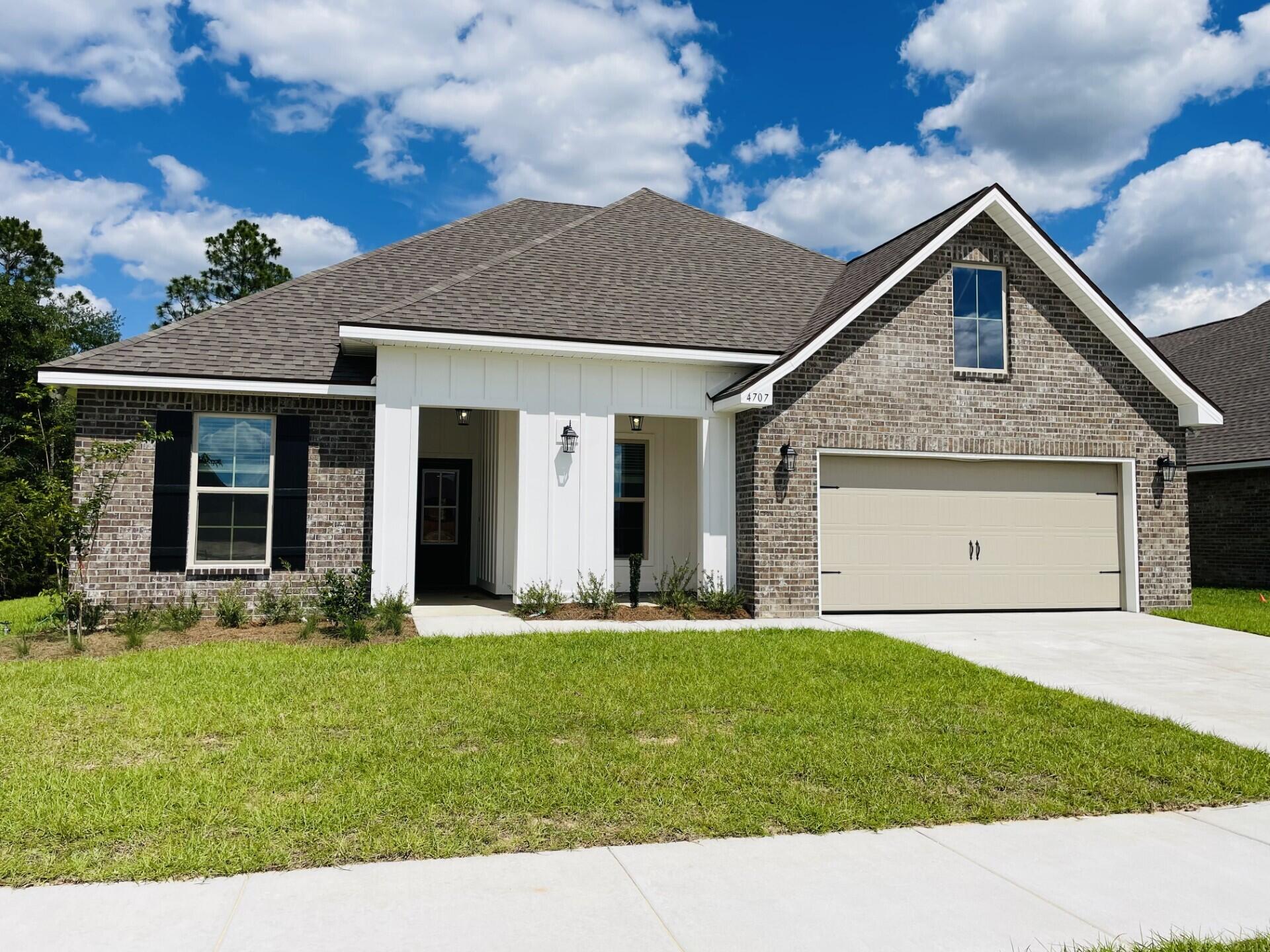 Awesome Builder Rate Incentives! (Restrictions apply) The HICKORY III G in Patriot Ridge community offers a 5 bedroom, 3 full bathroom, open design. Upgrades added (list attached).Features: double vanity, garden tub, separate shower, and walk-in closet in master suite, double vanity in all other bathrooms, den, formal dining room, covered front and rear porches, boot bench at garage entry, recessed lighting, crown molding, ceiling fans in living room and master bedroom, smart connect Wi-Fi thermostat, smoke and carbon monoxide detectors, landscaping, architectural 30-year shingles, flood lights, and more!Energy Efficient Features: electric water heater, a kitchen appliance package with a electric range, vinyl low E MI windows, and more!