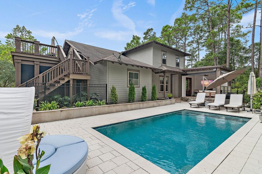 UNDER CONTRACT, SELLER WILL ACCEPT BACK UP OFFERS.  Located on a peaceful double-sized lot and backing onto mature green space, this unique cul-de-sac residence enjoys exceptionally scenic views. Completely remodeled in 2023, it is truly a one-of-a-kind nirvana with thoughtfully designed additions and custom upgrades with no expense spared. New bathrooms, coffered ceilings and Serena and Lily wallpaper create a series of rooms for relaxing and entertaining, each with a unique identity and character. The custom eight-foot mahogany front door opens to reveal a home graced with upgraded wood flooring, new lighting and a renovated wood-burning fireplace in the living room. Head into the gourmet kitchen, where deep custom cabinets showcase soft-close doors, drawers and pull-out shelves Beautiful quartz counters offer a neutral backdrop to the understated matte white GE Cafe appliances with brushed bronze hardware. The generous island is perfect for casual dining, complementing the formal dining area where double doors open to the newly created entertainment room with wine fridge, adding more than 3,200 square feet of living space. This, in turn, opens to a climate-controlled screened cabana overlooking the pool. The lavishly appointed first-floor master suite boasts a fully renovated large walk-in custom closet, a separate oversized tile shower, new granite vanity and a spa-like jetted oval tub. The bedroom flows into its own private outdoor lounge area surrounded by stone pavers with peaceful wooded and lake views. This climate-controlled lounge area offers remote motorized mesh screens for the ultimate indoor/outdoor living. On the second level, three bedrooms, one with a private balcony, share two newly added and renovated baths with walk-in shower, shiplap walls, double and single vanities and beautiful tile floors. The large bonus room can be converted into a fifth bedroom by adding a closet or used as a media or living room. It opens to a large deck, perfectly positioned for enjoying a quiet cup of coffee with the birds while admiring peaceful Lake Powell views. The serene metal-fenced yard delivers a sense of being immersed in nature. If desired, there's ample space to add an outdoor kitchen or a guest cottage. The saltwater pool is surrounded by artisan white shell pavers, creating a clean, unfussy place to relax and dream. The adjoining climate-controlled cabana with remote-controlled screens offers a change of tempo with a TV and lounge seating for quiet reading or open for entertaining guests or watching sports. Conveniently close to 30A attractions, restaurants, and amenities, this Wild Heron retreat bordering Lake Powell enjoys some of the finest amenities in the area, including gated security, a playground, a fire pit, a heated pool and a hot tub. Stay fit with the fully equipped fitness center and 24 miles of pet-friendly walking/biking trails. The boathouse is fully stocked with kayaks and paddleboards for enjoying the coastal dune lake and the beautiful white sandy beaches of the Gulf of Mexico. A brand new dock and marina with boat slips were just completed with a public boat launch conveniently located nearby. A brand new golf course on the north and east ends, connecting to Watersound Origins, is sure to bring added value to this 734-acre coastal community. Outdoor live music, a farmers' market, kids' movie night and food trucks create a fantastic lifestyle with optional membership to WaterSound Beach Club and tennis courts. All this, just minutes from 30A, the Rosemary and Alys Beach communities and Pier Park attractions.  Buyer to verify all data and dimensions.