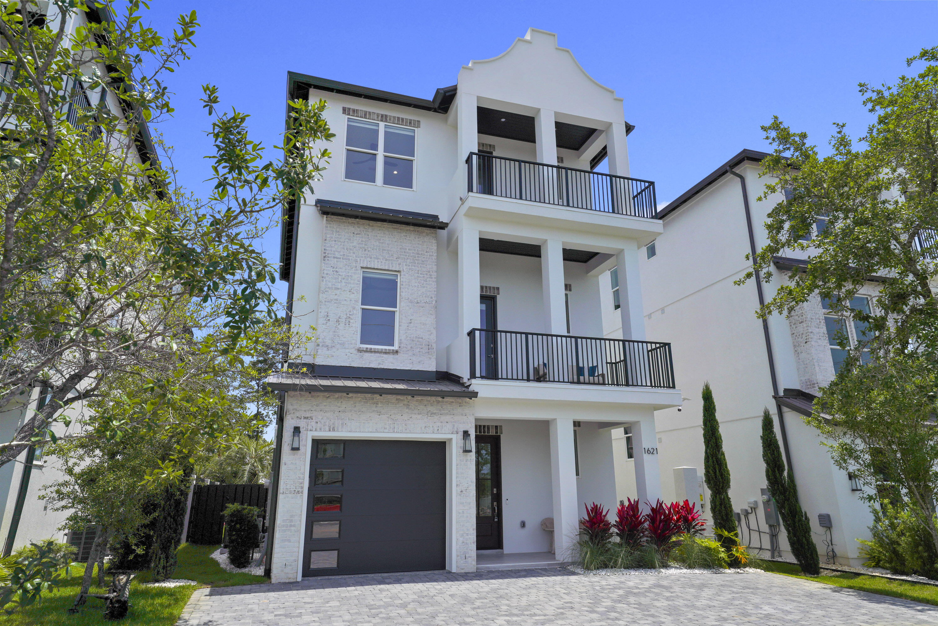 This extraordinary NEW Construction home is a lavish sanctuary mere steps from dining, shopping,and the beautiful white sand beaches. This opulent coastal masterpiece. It has 5 bedrooms and 6.5 bathrooms w/master en-suite bath that has stand alone tub and walk in shower and custom tile through out. Upon entering the home you will fall in love with the open concept living areas that merge with multiple outdoor porches which offer Gulf views from elevated vantage points. First floor game room which opens to the pool area for extra indoor/outdoor feel. 2 Bunk Rooms and Bunk niche, 10 total bunks. Each floor has washer/dryer, wet bar, microwave drawer and small fridge.The kitchen/ dining area has a massive island that seats 14 and gorgeous lighting from Restoration hardware.