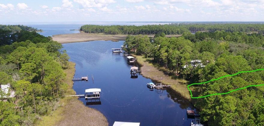 Over half an acre on the water (.58) per tax records! This beautiful lot is located on a quaint street is nestled in the heart of Point Washington, beautiful and private views surrounded by gorgeous beaches several miles away. Make this part of paradise your home! Buyer to perform any and all due diligence deemed important.