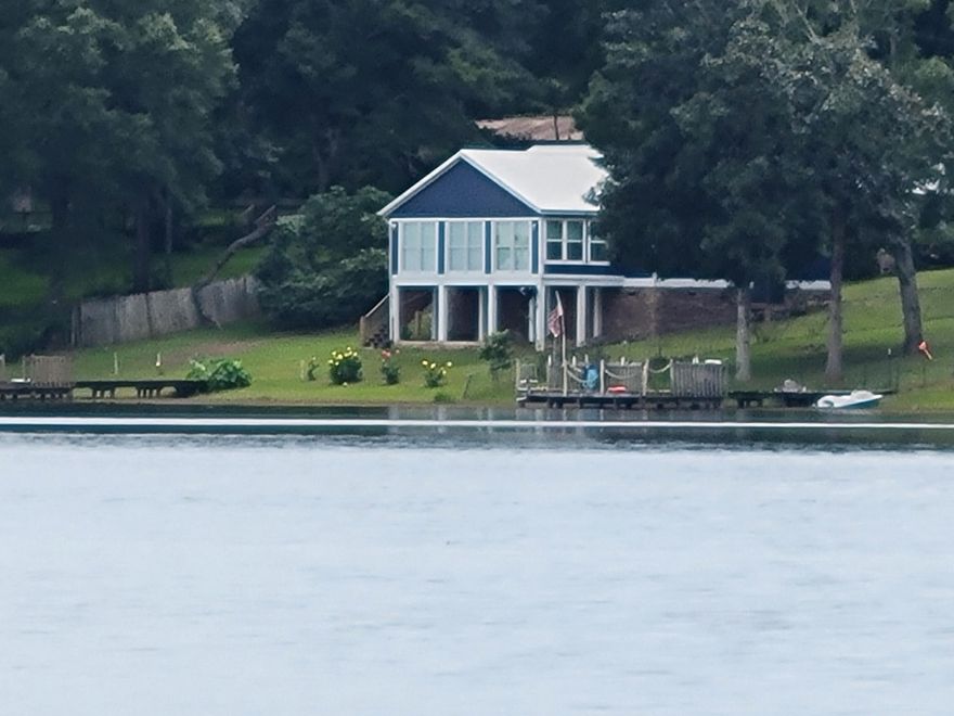 Cabin/Farm House on 2 waterfront lots on Kings Lake.....it feels like a brand  with all new flooring, freshly painted interior and exterior, new pine walls in new living room with large windows that bring nature right into your lap;  Kitchen has added new kitchen and dining room with silver metal/tin  accents on kitchen bar counter with one accent wall in the dining room adds to the cabin/farm house feeling.  Home includes washer and dryer and all new stainless steel kitchen appliances added in 2022, new A/C  added in 2020.  It is a cozy 3 bedrooms, 2 bath home. The master bedroom with walk-in closet with ventilated shelving and storage drawers.  Need Pre-Approval Letter for appointment or proof of funds. Seller will pay title insurance and Doc. stamps on the deed. 'click MORE'