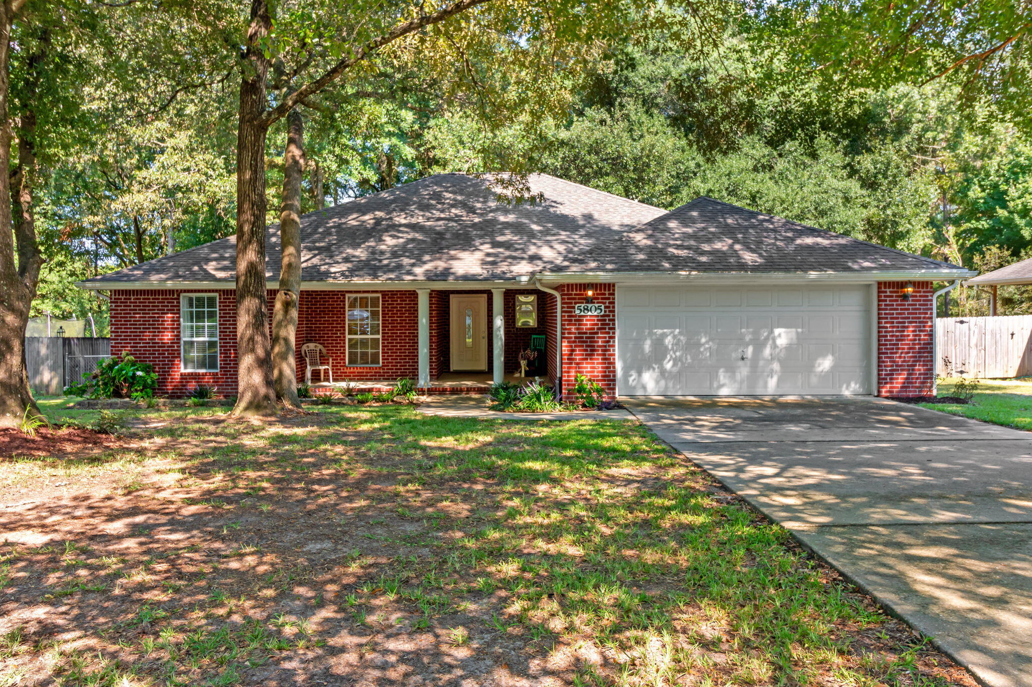Welcome home to this charming brick home surrounded by mature trees and set up for easy living. You'll find a very functional layout, lots of natural light, and beautiful views of the outside foliage from inside as well as from the oversized screened in patio. Dine al fresco without the bugs disturbing you! Whether you need space for a young family or the ease of single floor living during any stage of life, this is one you can truly make your own. This quaint cul-de-sac neighborhood is just about a mile from conveniences such as schools, stores and restaurants. You can have peace and quiet as well as convenience. Also to note is that the gorgeous Emerald Coast is only 47 miles away, so a day trip or weekend to the beach is definitely within reach for beach lovers. Call today!