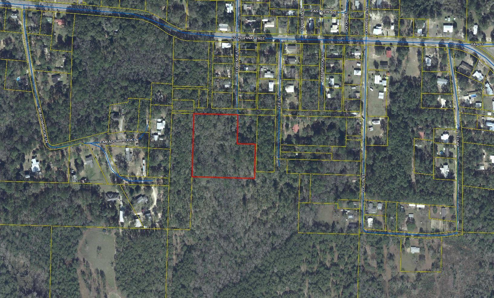 Building/development parcel in the heart of Defuniak Springs, close to Lake Defuniak and the revitalized down-town area. Zoned R1 and allowing maximum of 2.5 units per acre. Make your appointment today!