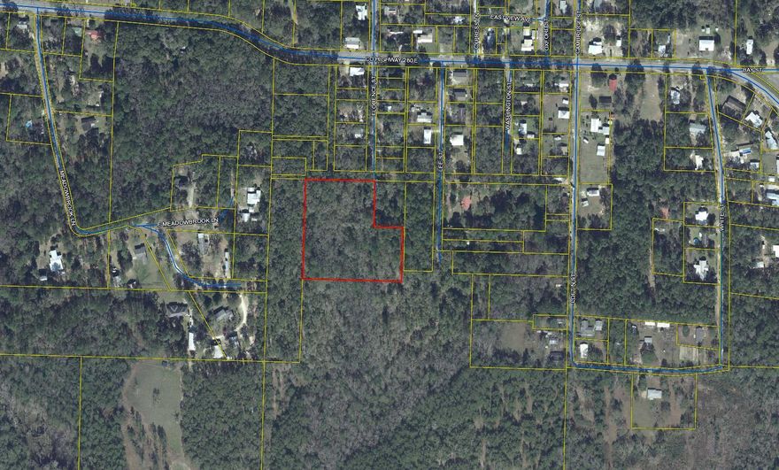 Building/development parcel in the heart of Defuniak Springs, close to Lake Defuniak and the revitalized down-town area.  Zoned R1 and allowing maximum of 2.5 units per acre. Make your appointment today!