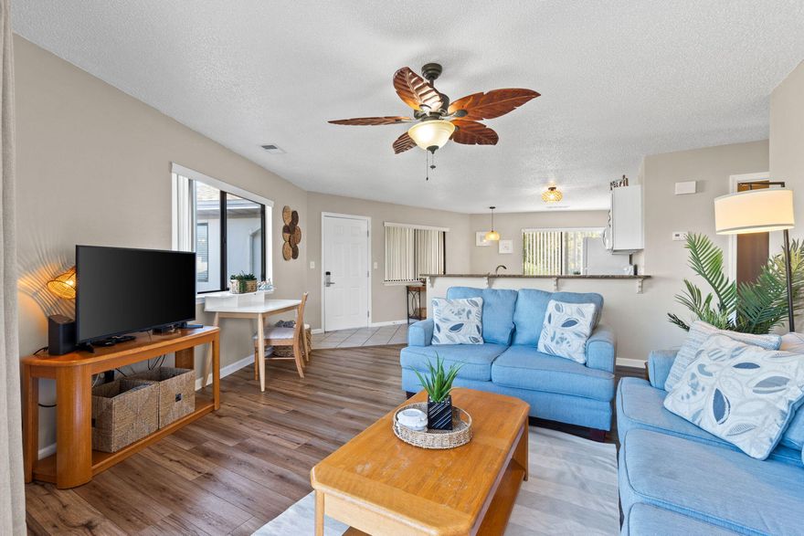 Beautifully updated top-floor 2-bedroom, 2-bath condo just 21/2 blocks from the BEACH perfect for full-time living, a vacation retreat, or an investment. Enjoy an open-concept layout with bright natural light, coastal touches, white appliances, in unit washer dryer, ample cabinet space, and a breakfast bar. Sold furnished for a true turnkey experience. The spacious living area opens to a patio overlooking the pool, ideal for relaxing after a beach day. Assigned parking space right outside. Close to restaurants, shopping, and the Regional Beach Access with its dolphin-shaped reef. Short-term rentals allowed.