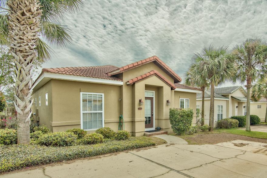 Mediterranean charm is the perfect way to describe this three bedroom home in the quaint community of Tuscany. Tile throughout the home. The living room is open to the kitchen with lots of windows letting the light shine into the great room. Three bedrooms and two full baths. There is a screened in patio with a bar in the back yard. This is the perfect location, close to the beach and shopping.