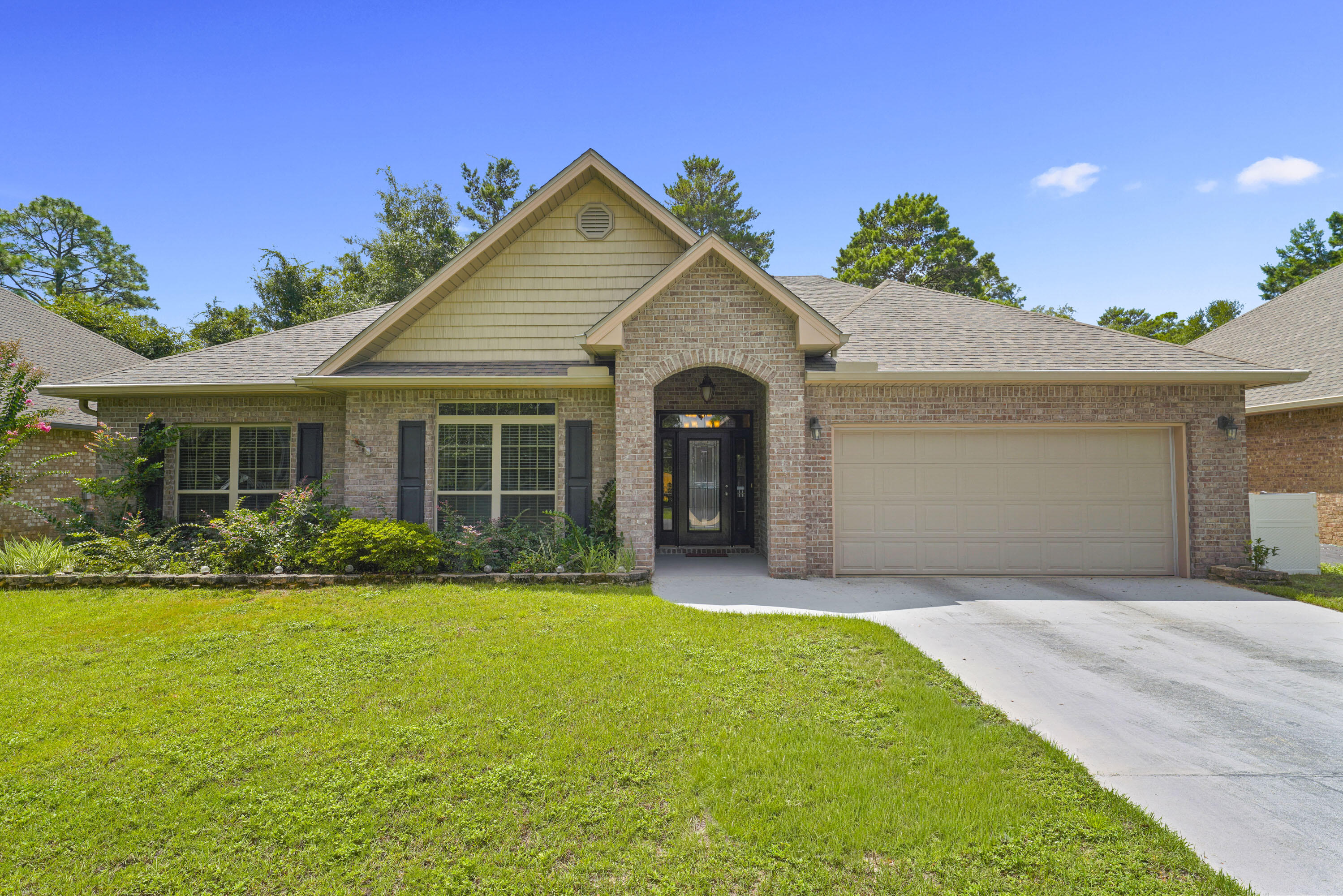 79 Bella Boulevard is a well-maintained four-sided brick home in Santa Rosa Beach. The single-story layout separates the main living and entertaining areas from the bedrooms, creating a comfortable and functional flow. Cathedral ceilings and double-pane windows bring in natural light, and hardwood floors in the living room combine with laminate in the hallway and bedrooms for a warm, easy-to-maintain interior.The kitchen features granite countertops, an upgraded cabinet package, recessed lighting, a premium marble accent wall, and a large double pantry. Crown molding carries throughout the home, adding a clean finish to each space. The main bathroom has an updated shower, and the laundry room includes overhead cabinetry. All window treatments remain with the home. 79 Bella Boulevard is a well-maintained four-sided brick home in Santa Rosa Beach. The single-story layout separates the main living and entertaining areas from the bedrooms, creating a comfortable and functional flow. Cathedral ceilings and double-pane windows bring in natural light, and hardwood floors in the living room combine with LVP in the hallway and bedrooms for a warm, easy-to-maintain interior.
The kitchen features granite countertops, recessed lighting, a premium marble accent wall, and a large double pantry. Crown molding carries throughout the home, adding a luxurious finish to each space. The guest bathroom has an updated walk-in shower, and the laundry room includes overhead cabinetry. All window treatments and appliances remain with the home.
The backyard is one of the property's best features. It backs directly to preserve lands, offering privacy and a natural setting. Outdoor living includes a 19 by 16 deck, a screened patio with a ceiling fan, pavers, and river rock landscaping. The yard is partially fenced with two gates, and there is a clean storage shed finished with tile flooring. The yard includes an in-ground sprinkler system, gutters and downspouts, a glass front door, flood lights, and an 80-gallon hot water tank with a utility sink in the garage. A transferrable termite warranty is also in place.
Peach Creek is convenient to some of the best spots on the Emerald Coast. The 30A beaches are only a short drive away, with shopping and dining at Pier Park within easy reach and Destin and Miramar Beach not far to the west. The location offers central access to many of the premier destinations in the area while still providing a private setting at home.