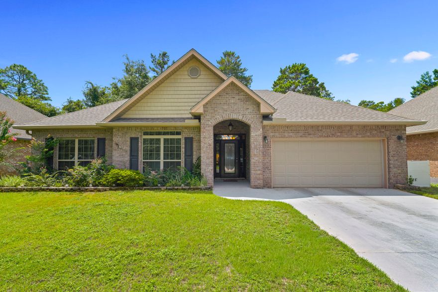79 Bella Boulevard is a well-maintained four-sided brick home in Santa Rosa Beach. The single-story layout separates the main living and entertaining areas from the bedrooms, creating a comfortable and functional flow. Cathedral ceilings and double-pane windows bring in natural light, and hardwood floors in the living room combine with laminate in the hallway and bedrooms for a warm, easy-to-maintain interior.The kitchen features granite countertops, an upgraded cabinet package, recessed lighting, a premium marble accent wall, and a large double pantry. Crown molding carries throughout the home, adding a clean finish to each space. The main bathroom has an updated shower, and the laundry room includes overhead cabinetry. All window treatments remain with the home. 79 Bella Boulevard is a well-maintained four-sided brick home in Santa Rosa Beach. The single-story layout separates the main living and entertaining areas from the bedrooms, creating a comfortable and functional flow. Cathedral ceilings and double-pane windows bring in natural light, and hardwood floors in the living room combine with LVP in the hallway and bedrooms for a warm, easy-to-maintain interior.

The kitchen features granite countertops, recessed lighting, a premium marble accent wall, and a large double pantry. Crown molding carries throughout the home, adding a luxurious finish to each space. The guest bathroom has an updated walk-in shower, and the laundry room includes overhead cabinetry. All window treatments and appliances remain with the home.

The backyard is one of the property's best features. It backs directly to preserve lands, offering privacy and a natural setting. Outdoor living includes a 19 by 16 deck, a screened patio with a ceiling fan, pavers, and river rock landscaping. The yard is partially fenced with two gates, and there is a clean storage shed finished with tile flooring. The yard includes an in-ground sprinkler system, gutters and downspouts, a glass front door, flood lights, and an 80-gallon hot water tank with a utility sink in the garage. A transferrable termite warranty is also in place.

Peach Creek is convenient to some of the best spots on the Emerald Coast. The 30A beaches are only a short drive away, with shopping and dining at Pier Park within easy reach and Destin and Miramar Beach not far to the west. The location offers central access to many of the premier destinations in the area while still providing a private setting at home.