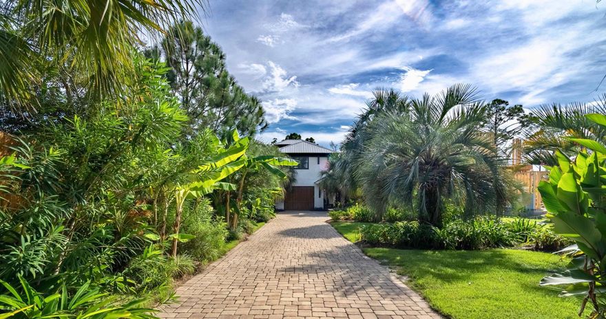 If your idea of fun includes the beach, boating, swimming and relaxing and your style is casual entertaining with your friends and family, then welcome home. This custom-built water sports dream home was painstakingly designed just for you. No attention to detail was too small. Designed as a builders own family retreat you will appreciate the architectural details that bring the sport of boating into the home. From the weathered timbers and paneling it's obvious that everything is hand crafted, and have you ever seen a more beautiful kitchen? The reclaimed wood that created the cabinets add so much character and the guest bath and entry may have been crafted from a Spanish Galleon wreck salvaged from the beach. Did you see the antique anchor chain and other treasures incorporated into thi incorporated into this incredible home? Open floor plan with 3 bedrooms plus built-in hall bunk, 3.5 baths, butler's pantry, huge covered patios, screened breezeways, a saltwater pool with summer kitchen equipped tiki hut, deepwater covered boat slip with lift and even a bocce ball court. The 0.8 acre lot includes a buildable waterfront lot. 