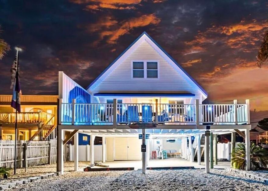 PRICE REDUCTION! Don't miss this one! Just a hop, skip, and a jump (or a quick ride) from the beach. Perfectly located right up the street from your favorite restaurants, fun parks or even a crawl home from the local beach bars! Get ready to embrace the ultimate coastal lifestyle in this stunning 4-bedroom, 2-bathroom home, perfectly positioned for breathtaking lagoon views and just a leisurely stroll to the Sugar Sandy Gulf Beaches! This gem is Turnkey ideal for your sun-soaked summer getaways or as a profitable rental investment. Equipped with luxury vinyl plank custom flooring throughout, a beautiful kitchen island complemented by a chic glass backsplash, and stainless-steel appliances that bring both elegance and functionality. Plus, enjoy the convenience of a full-size stackable tranquil lagoon and only three blocks from the sparkling Gulf. Dive into endless aquatic adventures and memorable beach days with family and friends! Outdoor Oasis set on a spacious corner lot, the vinyl-fenced backyard offers ample room for outdoor fun, barbecues, and lounging under the sun. You'll also appreciate the generous parking options with a covered garage (12.5' x 25') and an additional lock-out unit for your convenience. Boater's Paradise just blocks away from a community boat ramp, this home provides easy access for exploring the beautiful local waters with your boat! Convenient Amenities with delightful local restaurants and shopping options just around the corner, everything you need is within easy reach, making life a breeze! Modern Upgrades enjoy peace of mind with vinyl impact windows, stylish plantation shutters, a durable metal roof, and a composite front deck with elegant stairs that elevate the home's curb appeal. Fully Furnished this home comes furnished (minus personal items), ensuring a smooth transition into your new beachside lifestyle! Don't let this incredible opportunity slip away! Whether you're after a summer retreat, a lucrative rental investment, or your forever coastal home, this property is ready to make your dreams a reality. Contact us today for a private showing and step into your new coastal haven!