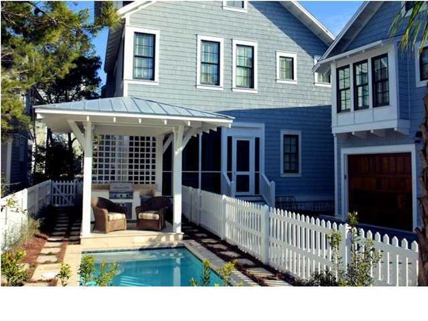 This beautifully furnished home with heated pool and covered grill in Watersound Beach is the perfect primary or vacation residence. Located on a rare, oversized corner lot this property must be seen to be appreciated. The first floor includes a gourmet kitchen complete with enormous island, plenty of bar seating, Sub-Zero / Wolf appliances and beautifully appointed fixtures. The first level also contains the dining and living areas, guest bedroom, full bath and laundry room. The second floor opens up to an additional living space, master suite and 2 additional bedrooms complete with their own ensuites. The third floor welcomes you with an air conditioned tower and plenty of natural light to view the Gulf of Mexico. A two car garage and carriage home are the final touches on this