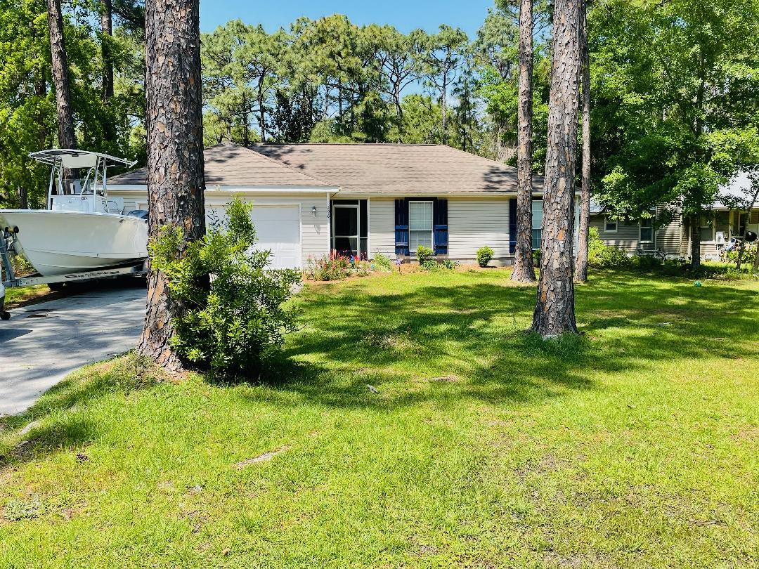 Everything you need and more in a three bedroom/two bathroom house less than three minutes from 30A on a huge wooded fenced in lot. Home underwent a total renovation in 2020 and 2021, as well as having a bonus room added off the main living room provided an additional 200 sq/ft. Every aspect of this house has been maintained or updated for the next owner. Not only has it undergone a complete cosmetic facelift, the owners made massive upgrades such as replacing the septic drainage field in 2017 and having brand new Goodman A/C installed March 2021 with 10 year warranty. Every kitchen appliance was purchased brand new in 2020 with Whirlpool fingerprint resistant stainless steel. Kitchen completely updated in 2020 with granite counter tops. New flooring in all bedrooms in 2020.