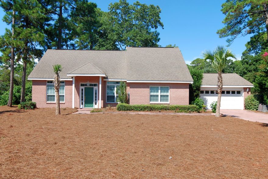 Amazing 3BR/2BA home on a large corner lot, under a half mile to the beach. This home features a large open floor living space, gas fireplace, vaulted ceiling, & an overlook area at the top of the stairs. The kitchen features Corian countertops, black & stainless appliances, wood cabinetry, and a breakfast bar. The master suite features a large walk-in closet, double vanities, jetted tub, & separate shower. Other features include 2 additional bedrooms (located on the second floor), large garage with workshop bench, screened back porch, & a yard building. Just a short walk or drive to the beach!!!