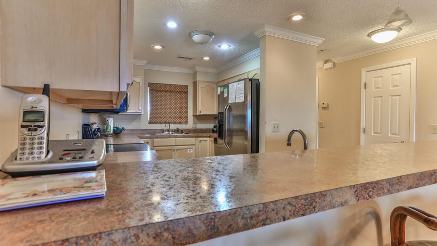 The Aegean is a beautiful gated condominium on Holiday Isle. This is one of the few complexes with ground floor beach front units. It is a 2 bedrooms/2 bath with large bedrooms and over 1500 sq. ft. When you walk out your back door you're just steps away from the boardwalk and the beautiful Emerald Green water. The complex also features a pavilion for grilling and tennis courts on each side of the condominium.