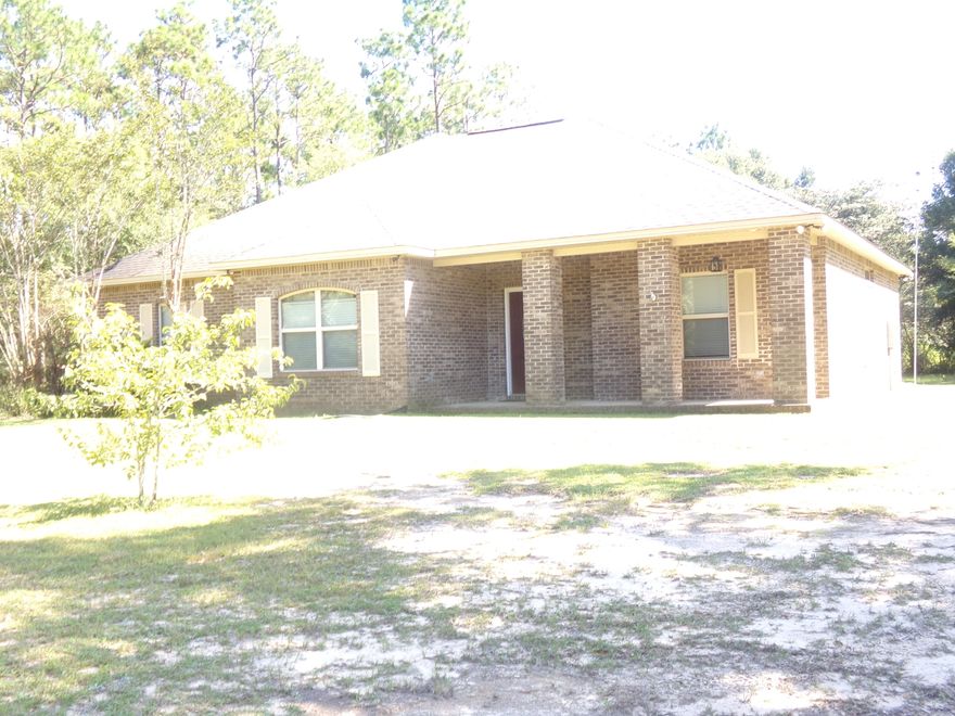 This beautiful, well maintained all brick 3 bd / 2 ba home on 1.28 acres is a must see~ Beautiful hardwood floors in both living room and master bedroom~ Living room has plant ledges, recessed lighting and French doors that open onto the covered back porch~ Formal Dining room as well as breakfast nook just off the kitchen~ Kitchen has smooth top range, stainless steel appliances and granite counter tops with plenty of cabinets and drawer space~ Master Bath offers a whirl pool tub, large separate shower and double vanity. There is crown molding throughout to grace the 9 foot ceilings, master bedroom has coffered ceiling and living room and kitchen have cathedral ceiling~ Tile in kitchen, breakfast, dining, bathrooms and laundry room~ There is too much to mention~