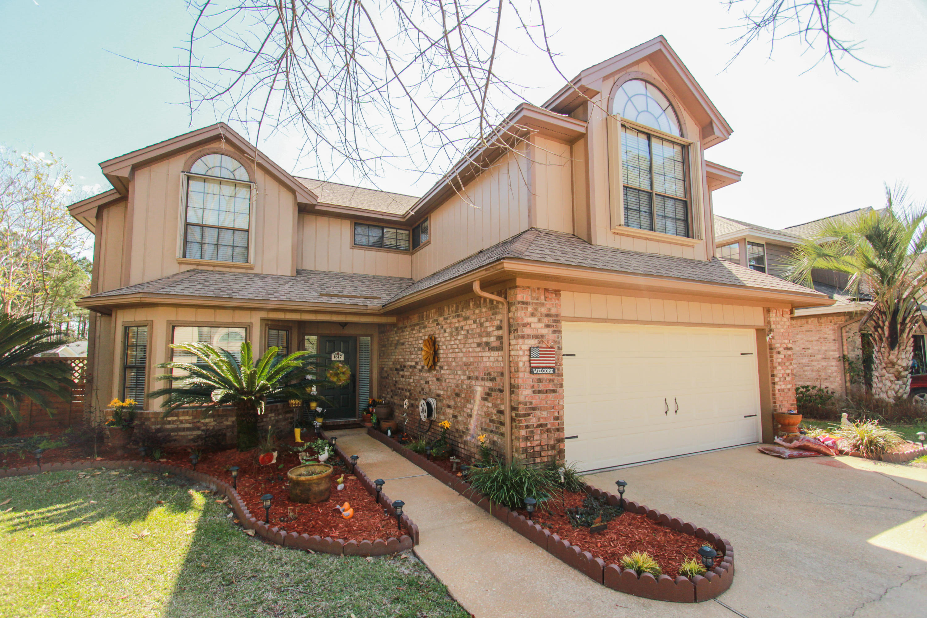4 Bed, 2.5 Bath, Refined and Relaxed Fort Walton Beach ResidenceArriving in the oversized driveway, note your new home's brick accents and established verdant landscaping.Upon entering, the tiled entry way transitions to a breakfast nook full of natural light from a bank of three windows that overlook the front of the property. Into the kitchen, ample granite-topped counter space wraps around both sides of the kitchen, complete with double basin sink, terrazzo backsplash, stainless steel appliances and a granite island. A breakfast bar overlooks the dining and living rooms''open floor plans, hardwood floors, fireplace and vaulted ceilings complete these grand living areas, which offer access to a screened-in, covered patio that overlooks your backyard complete with privacy fen