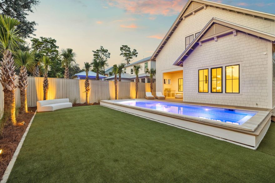 Located in the gated Lakeside Inlet Beach community, this newly built home by Focus Construction blends high-end craftsmanship with coastal elegance. Just minutes from Rosemary and Alys Beach, and steps from Lake Powell, this residence offers the perfect combination of luxury and convenience.Step inside to soaring 11' ceilings on the first floor accented by rich hardwood floors and cypress wood ceiling details. The vaulted living room creates a light-filled gathering space that flows seamlessly into the gourmet kitchen, complete with Thermador appliances, custom shaker cabinetry, a walk-in pantry, and champagne-accent hardware. The first floor features two bedrooms with ensuite baths, including a stunning primary suite with a vaulted ceiling, spa-style bathroom with a garden tub, frameless glass shower, and custom walk-in closet.

Upstairs, you will find a secondary den and living space, two additional bedrooms with a full bath, and a large mechanical and storage room that provides excellent utility and extra space for organization or seasonal items.

Outdoor living shines here with a heated pool featuring a sun shelf, a backyard recreation area with artificial turf, and an outdoor kitchen with BBQ, sink, and refrigerator surrounded by lush palms and professional landscape lighting. The two-car garage, paver driveway, and gas lanterns complete the home's exterior charm.

Elevated finishes rarely seen in homes at this price point make this property stand out. Thoughtfully designed for full-time living, use as a second home, or as an investment property, this residence offers both flexibility and luxury.

Residents of Lakeside enjoy private lake access, a community pool, and a shared dock on Lake Powell. With the pedestrian underpass offering direct access to 30A, you are just a short walk or bike ride from the Gulf, as well as dining and shopping at 30Avenue including Amigos, Amici's, Cuvee, Idyll Hounds Proper, and Aja Elevated Asian.

This home is a rare opportunity to own a well-crafted and versatile property in one of Inlet Beach's most desirable communities.