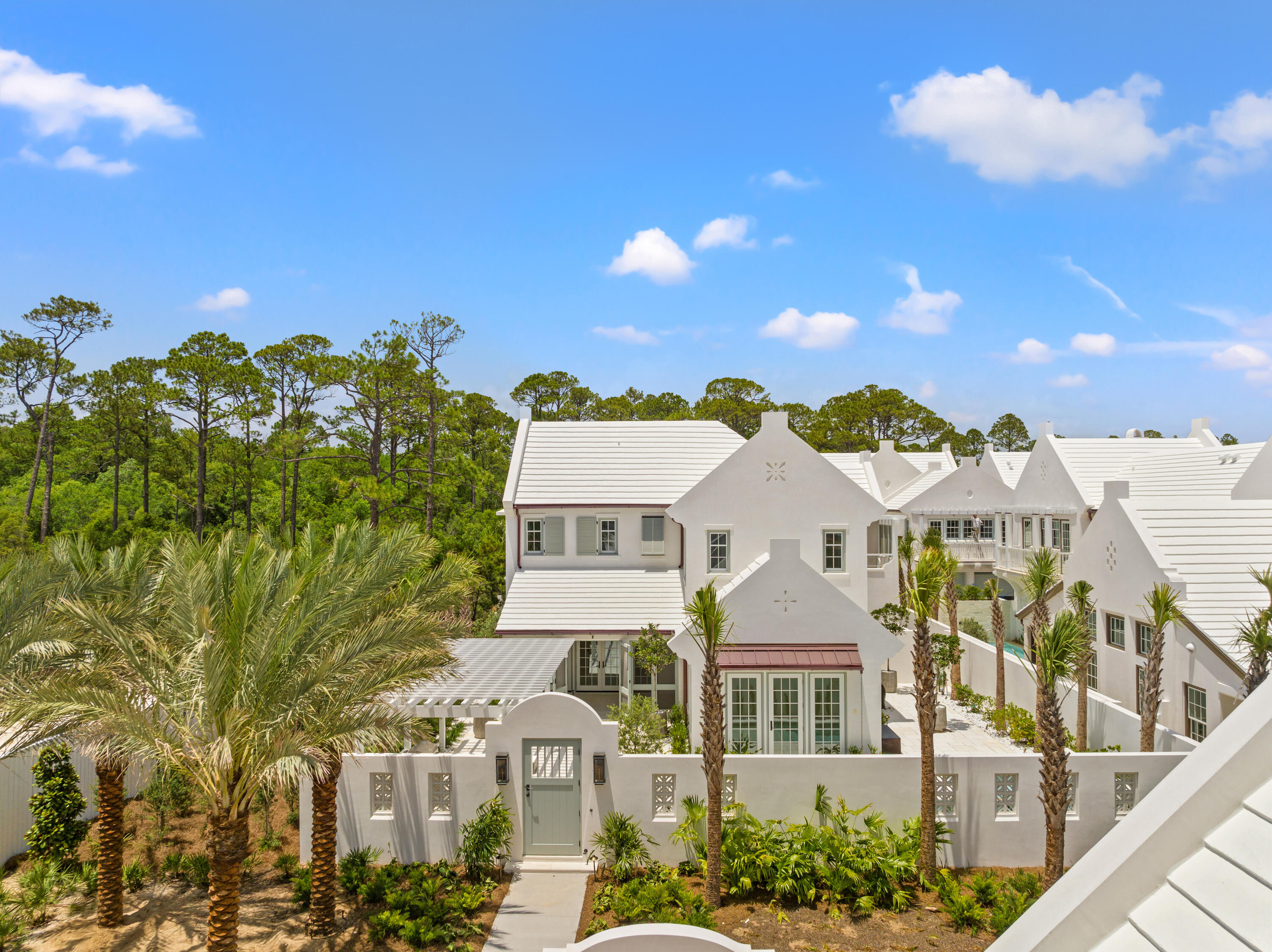 This Somerset Home, GG12, features streetscapes characterized by white garden walls that open onto a rugged natural landscape. A neighborhood that is bit more ''Country'' than ''Town.'' Much emphasis was placed on outdoor living with an open arrangement of interior spaces extending outdoors with garden rooms and courtyards shaded by trellises and arbors. Outdoor gathering places with firepit alcoves, water features, thoughtfully placed pools, covered summer kitchens and bars, and screened garden rooms are designed to maximize each property's use and enjoyment. GG12 fronts the 20-acre Nature Preserve, in close proximity to the The Silva amenity to be delivered in the GG Block. The Silva will be comprised of a central event lawn, an enclosed pavilion opening onto the event lawn, pool, and covered terrace with bar and cafe.