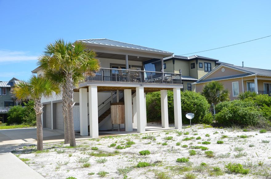 Enjoy views of the Gulf of Mexico from the south facing balcony of this top-of-the-line carriage house while building your dream home on the bulk of lot that remains vacant. This 1BD/1BA guesthouse was custom built to withstand any severe storm. It is 12' core poured solid block on the first floor and 8' on the second floor. It features an aluminum roof with 200 MPH rating, and 140 MPH windows and doors. The water-view balcony has a hot tub with a new motor and new panel. It also has recessed lighting, speakers, and optional shades on the east and west sides for additional shade. All furnishings and decorations are to be included in purchase price unless they are not desired.Refer to supplement for additional information.