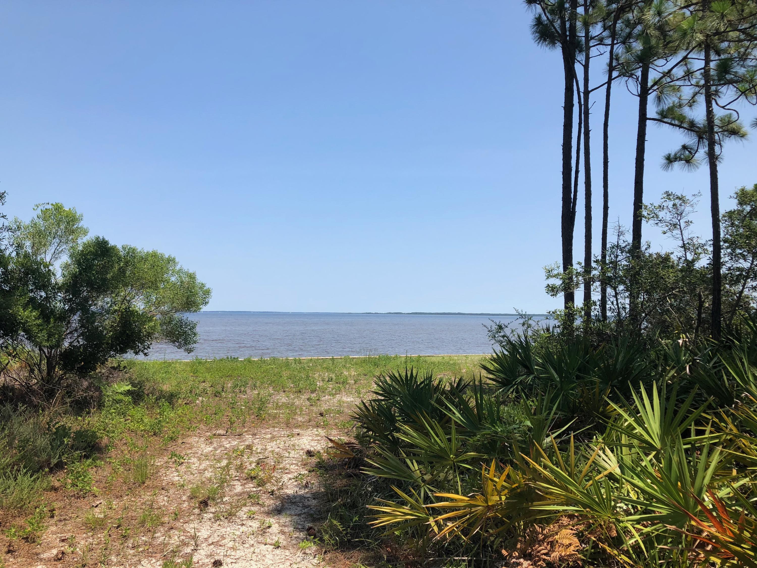 This breathtaking bayfront home site on the beautiful Choctawhatchee Bay offers 100' feet of bay frontage and eastern exposures affording incredible sunrise vistas. This prime location in Driftwood Estates is near outstanding golf courses, gourmet restaurants, upscale shopping at Grand Boulevard and excellent medical facilities. You'll have plenty of time to design the home of your dreams, as there is no mandatory time for build-out. Optional HOA fees are only $125/quarter. Just a short distance to Baytowne Marina in Sandestin, 12 miles to Crab Island and the Gulf of Mexico by water, this is the pinnacle of bayfront living.
