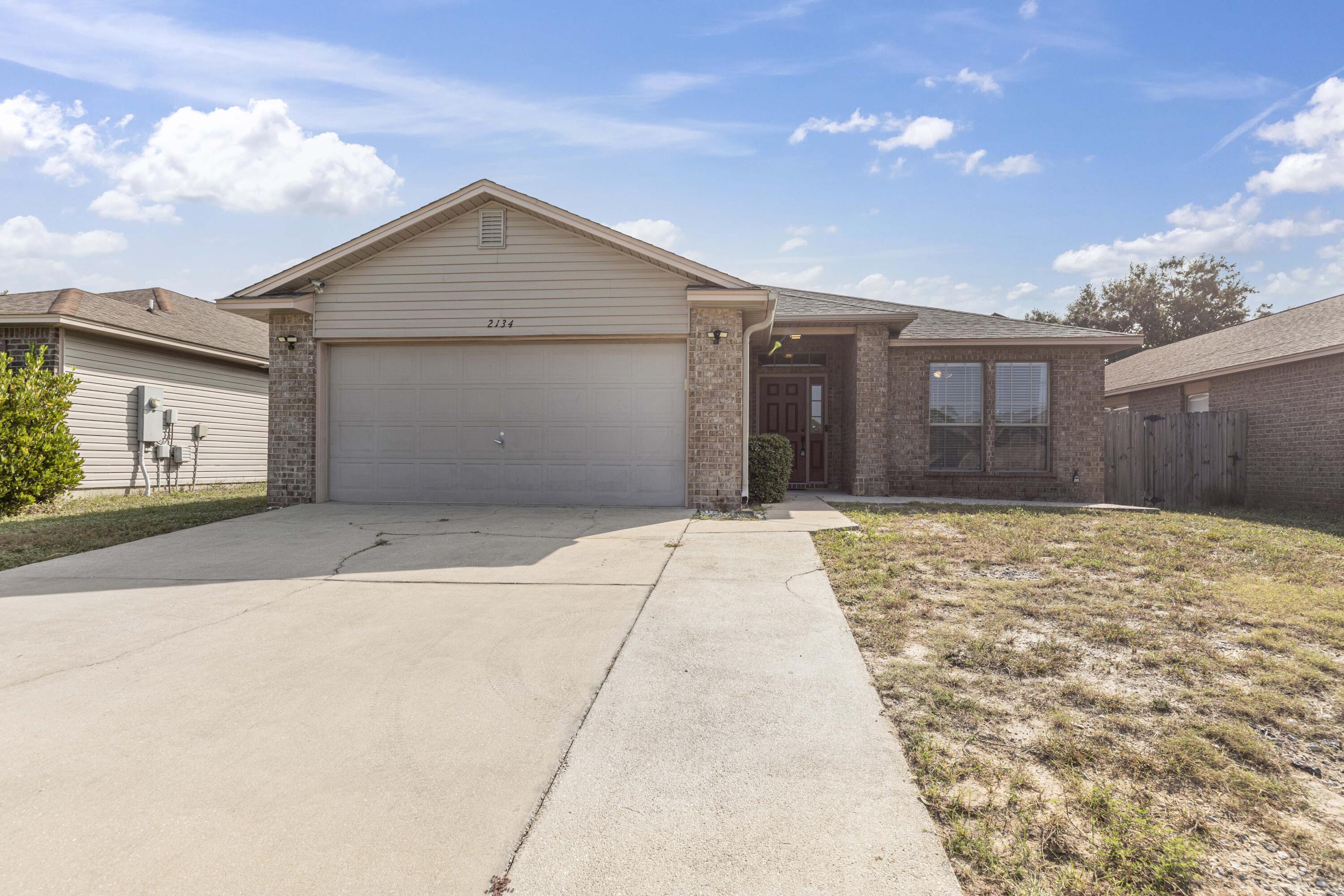 Welcome to your dream home, just 10 minutes from the stunning Navarre beaches! This single-family residence features 3 bedrooms and 2 bathrooms, with a brand new roof (2024) and water heater (2024). Step inside to discover the modern charm of updated indoor plumbing (2023), a beautifully renovated master bathroom (2023), a freshly painted living area (2023), and the home is equipped with solar panels to help reduce energy costs.Enjoy the freedom of an open concept layout, perfect for both relaxing and entertaining. This home is nestled in a cozy neighborhood with only one entrance and exit, offering peace and privacy without the constraints of an HOA.Outside, you'll find a welcoming back covered patio and a privacy fence, ideal for enjoying the Florida sunshine in seclusion.