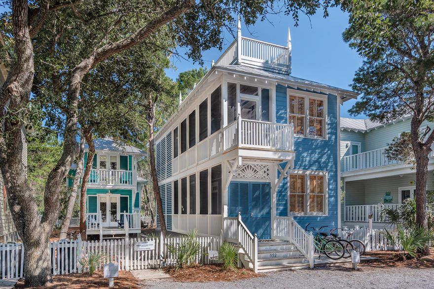 Main house 2 bedrooms, 2 1/2 baths. Guest house 1 bedroom, 1 bath. Richard Gibbs selected this lot and designed a main cottage with guest cottage for his personal residence during his tenure as Seaside's town architect. The cottages are surrounded by a grove of oaks on a quiet lot overlooking Forest Street Park. The embellished screened porch runs the entire length of the main cottage. Two bedrooms with private baths, along with laundry room are located on the first level. An outdoor shower is tucked under the stairway that leads up to the second floor. The great room is the true heart of the cottage. Interconnected living, dining and kitchen areas offer easy living. The dramatic raised ceiling with exposed cypress beams