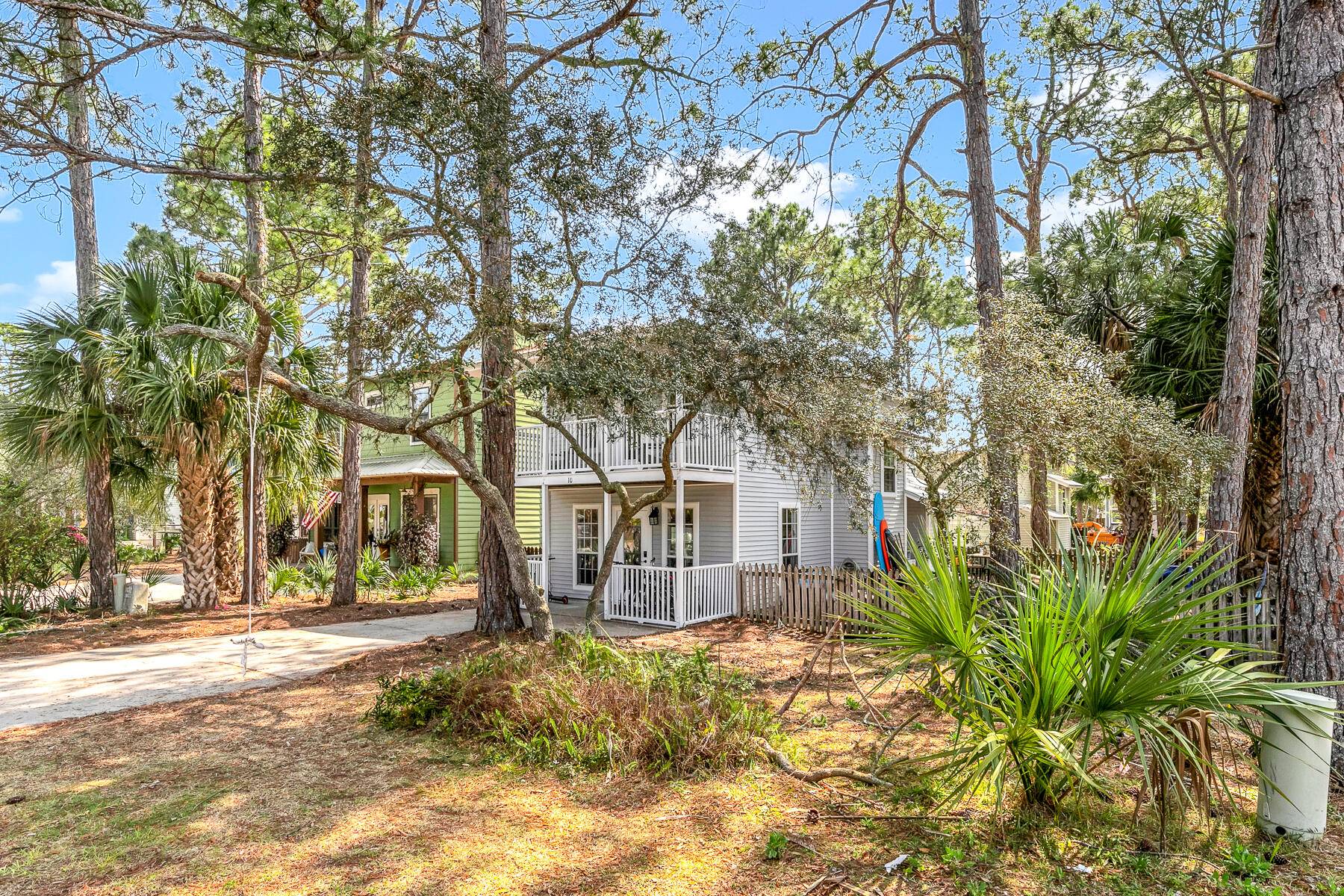 INCREDIBLE LOCATION! Perfect beach retreat situated on a GREAT corner lot in the ''Brickyard' of Blue Mountain Beach.' Tons of possibilities with this corner lot (with possible room for a pool or addition)! BRAND NEW kitchen with added window and patio door, new counters, cast iron sink, island, light fixture, stove and dishwasher. Freshly painted interior, updated LVP flooring, A/C compressor and air handler new in 2022/23, Updated bathrooms with new vanities, light fixtures and toilets. Ceilings recently scraped/painted. All new blinds. Master bedroom has a 2 closets and a balcony. No HOA. Could sleep 8-10 as a vacation rental. Close to the beach, the new Mimmo's, coffee shop, ice cream and much more.