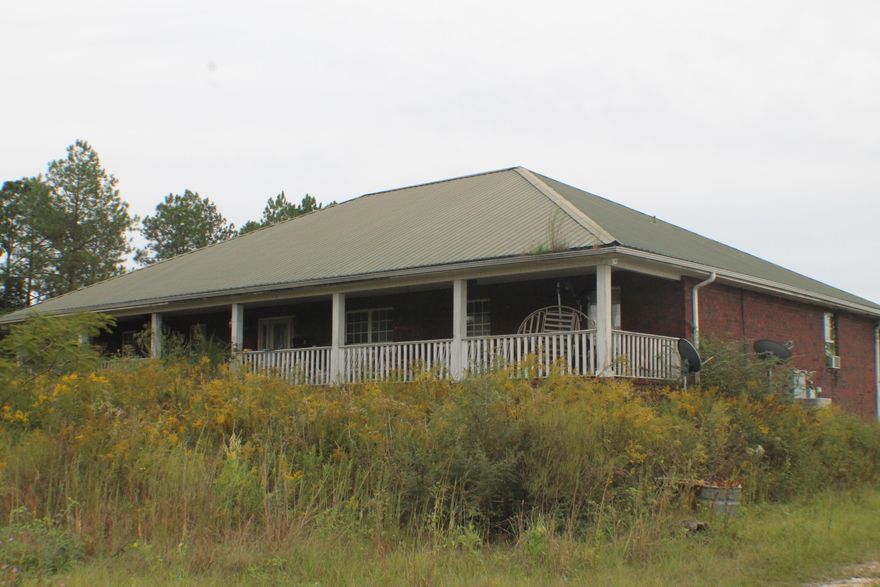 Short sale - House on 29 Acres. Brick with a metal roof on 29 Acres. Master bath garden tub and double vanity, surround sound, and recessed lighting with huge front porch. Floor plan in documents section. Sold As-is.