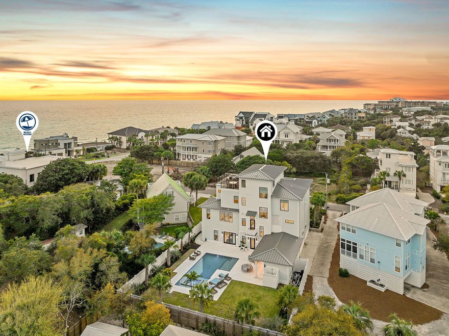 In the heart of Blue Mountain Beach, where the pace slows and the landscape feels more residential than resort-driven, 153 Gulf Point Road introduces a newly built coastal compound designed for both scale and livability. Set back on a rare 0.4-acre homesite along Scenic Highway 30A, the property feels intentionally removed from the road, framed by mature landscaping and established trees that create a sense of arrival more often associated with legacy homes than new construction. The experience begins outdoors. The rear of the property opens into a private resort-like setting, where a saltwater pool with spillover spa anchors the space. A fire pit, BBQ area, and expansive terrace create multiple zones for gathering, while the fully fenced yard adds both privacy and functionality. The breezeway connects the main residence to the outdoor living areas in a way that encourages movement between spaces, allowing days to unfold naturally between sun, shade, and water.

Inside, the home balances scale with thoughtful detail. The layout is expansive yet intentional, designed to accommodate both large gatherings and quieter retreats. Two primary suites provide flexibility for owners and guests, while the overall flow emphasizes comfort without sacrificing architectural presence. The upper level captures Gulf views, offering a more elevated perspective that complements the grounded, private feel of the homesite below.

There are moments throughout the home that feel distinctly considered. The outdoor shower connected to the primary bath creates a seamless transition from beach to living space. Fully furnished interiors allow for immediate use, reinforcing the idea of the home as a finished, ready-to-enjoy environment rather than a project. Practical elements, including tankless water heaters, dual HVAC systems, and a three-car garage with EV charging, support long-term ownership and everyday ease.

Beyond the property, the lifestyle of Blue Mountain Beach defines the experience. Local dining, beach access, and neighborhood conveniences are all nearby, yet the setting retains a quieter, more residential character along 30A. It is a place where mornings might begin with a bike ride to the beach, afternoons settle around the pool, and evenings extend outdoors under the trees.

153 Gulf Point Road feels less like a typical beach house and more like a private coastal estate, newly built but grounded in the kind of space, privacy, and architectural intention that rarely comes together in the center of Blue Mountain Beach.

