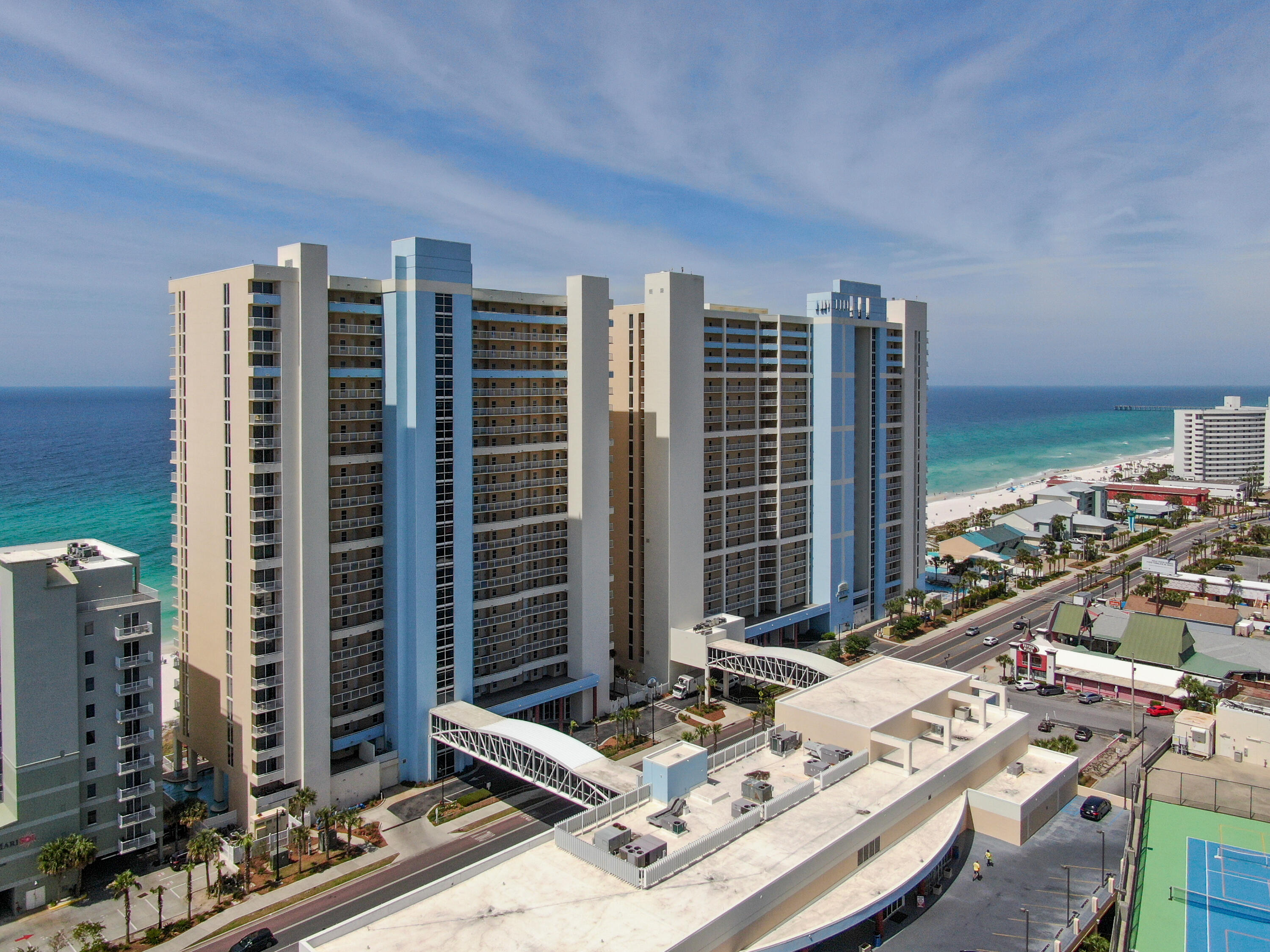 UPDATED! 2BR/2BA Gulf Front Condo in Fabulous Majestic Beach with unhindered sunset views. This complex is APPROVED FOR VA FINANCING. Updates: Flooring, Shower in master suite, bathtub and tile in 2nd bathroom, furniture, freshly painted, bunk beds added in 2nd BR as well as lighting & tv. AC shuts off when balcony doors left open for 3 minutes for lower electric bills. Majestic Beach Resort was renovated in 2019. It has everything you need! The Very Best Amenities: Tennis/pickleball, arcade/game room area, Starbucks coffee made on site at the market, H20 Bar and Grill by the poolside. (Seasonal) There are Five total pools, three outdoor pools, and two indoor pools! There are three hot tubs to choose from and several beach accesses/showers. There is a walkover bridge to each tower from the parking garage. covered parking, first come, first serve. There is a movie theater onsite, 24-hour security, vending/ice, Fitness center, dog run, and grilling areas. Convention center! By Walmart, Gift Shops, Fine Dining, Entertainment and just a few minutes to Pier Park! Don't miss out on this one!!!