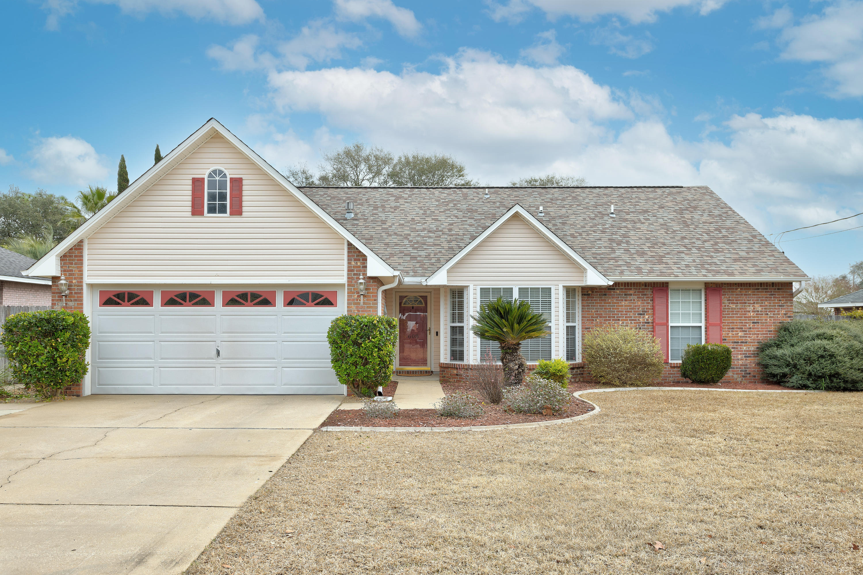 Welcome to 608 Huck Finn! This lovely home is located in South Crestview, below I-10 and zoned for Antioch Elementary. As you walk in the front door, you are greeted with a formal dining area that can be used as a flex space, home office, toy room, or formal living/sitting area. A few steps further into the home, the living room draws you in with its open and airy with tall vaulted ceilings & gas fireplace. The kitchen is just off the living room and has a dine-in area/breakfast nook. The first floor also features your indoor laundry room, primary bedroom with an en suite bath, another bedroom, and a three-piece bath. Upstairs are two bedrooms, a loft space, and another three-piece bath. Just beyond the Florida room is a large, privacy fenced yard with a refreshing in-ground pool!