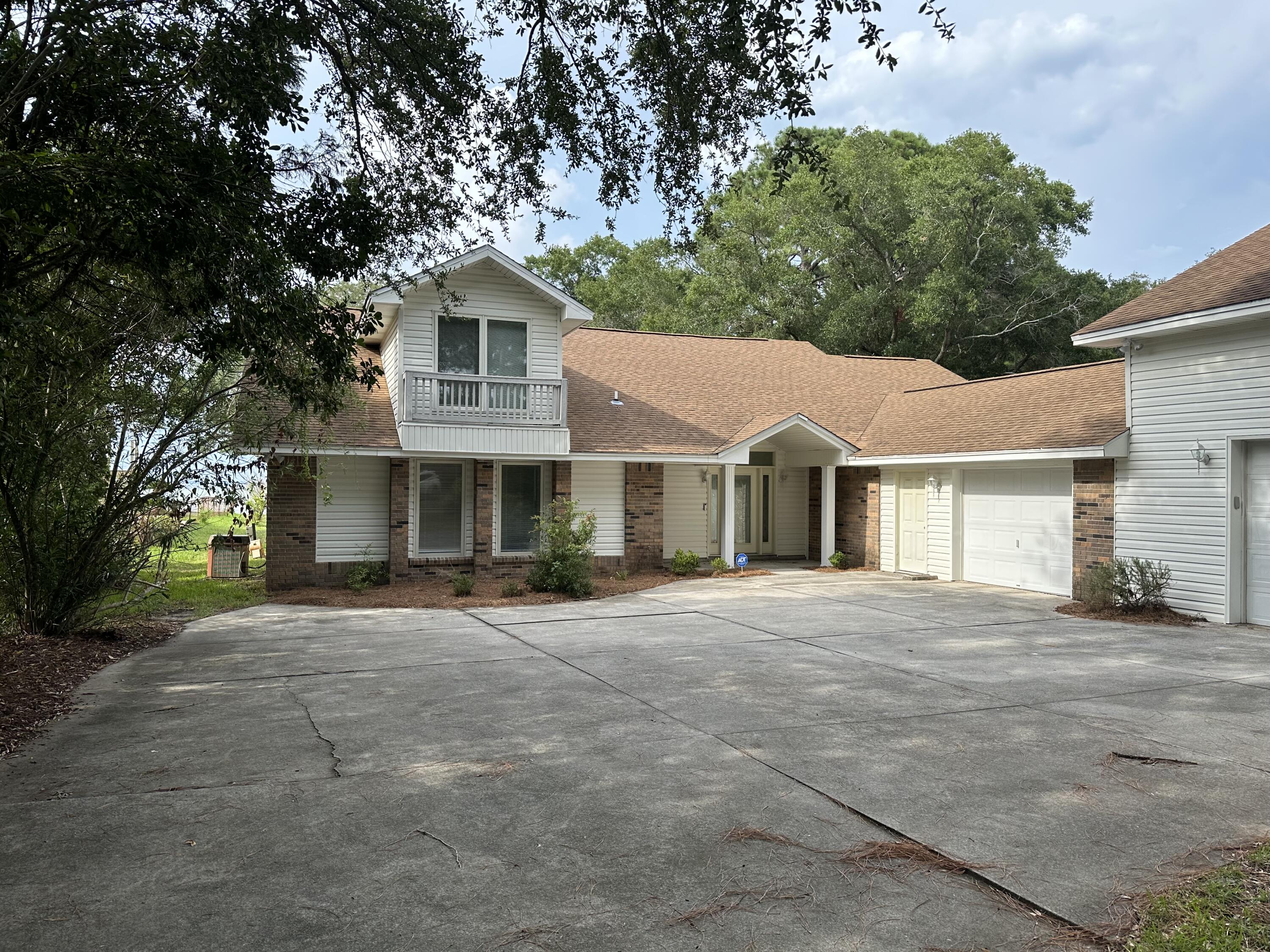 Waterfront living at its finest! Breathtaking vistas of sunrises and sunsets. Beautiful home on Choctawhatchee Bay in Destin. This home sits on .83 acres and has 3 bedrooms/ 3 baths with an extra-large loft that can act as an office or Bonus Rec/Game Room. The Grand Room faces the water with floor to ceiling windows and a kitchen/bar for entertaining. The best part is home has a dock with a boat lift and 3 jet ski lifts. The boat lift will fit a 24-30 foot center console. The dock also has swim steps with a ladder. Don't miss this opportunity for this rare waterfront opportunity.