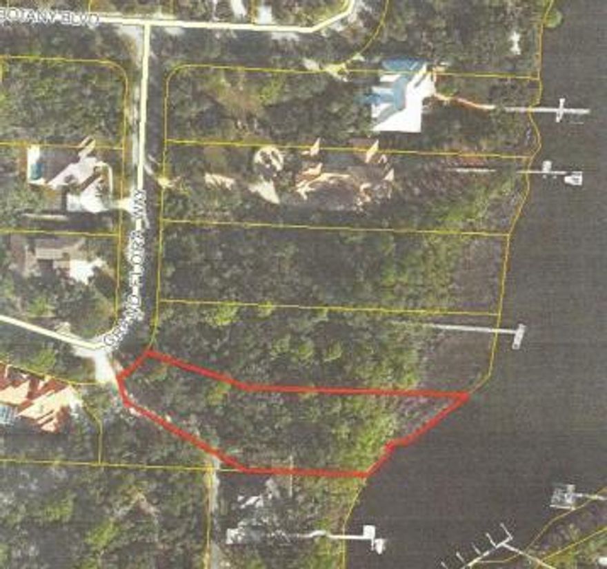 Beautiful large waterfront lot in gated community of Botany Bayou on Hewett Bayou short distance from Choctawhatchee Bay. 140' on the bayou.