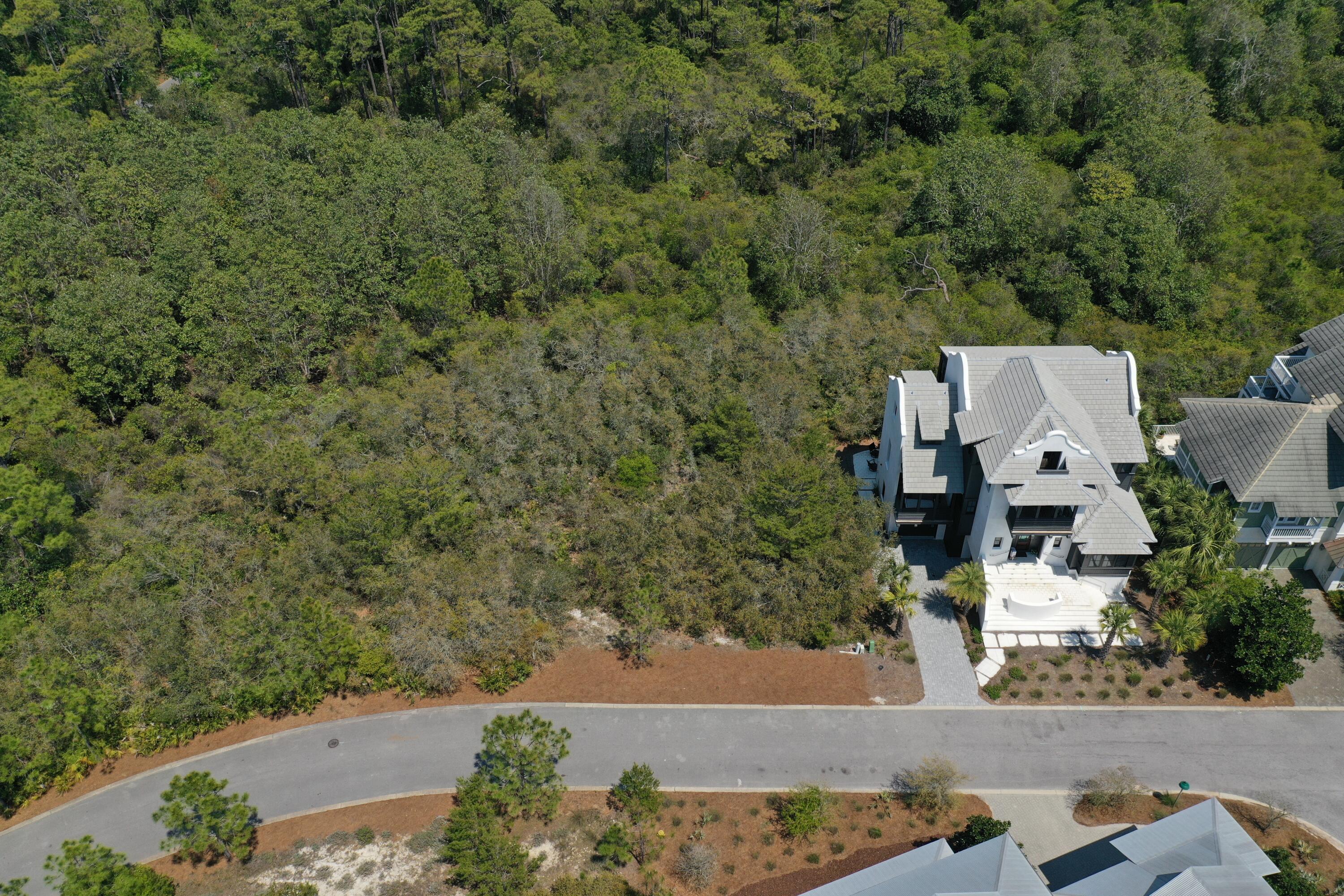 The Retreat Offers Premium Home Site for Luxury Beach Home! Bring your beach home dream to this Santa Rosa Beach lot less than two blocks from the sugar white sandy beach and emerald green Gulf of Mexico waters. Nestled into the gated community named The Retreat, the space fits the bill for the perfect beach retreat. You can relax to the max and entertain and enjoy friends and family in the comfort of a home that you have selectively designed for size, style, amenities, space and color. Luxury homes are the hallmark here with an intriguing blend of architectural styles inspired by Bermuda, the Caribbean, a little low country Cajun and some French and Spanish colonial.