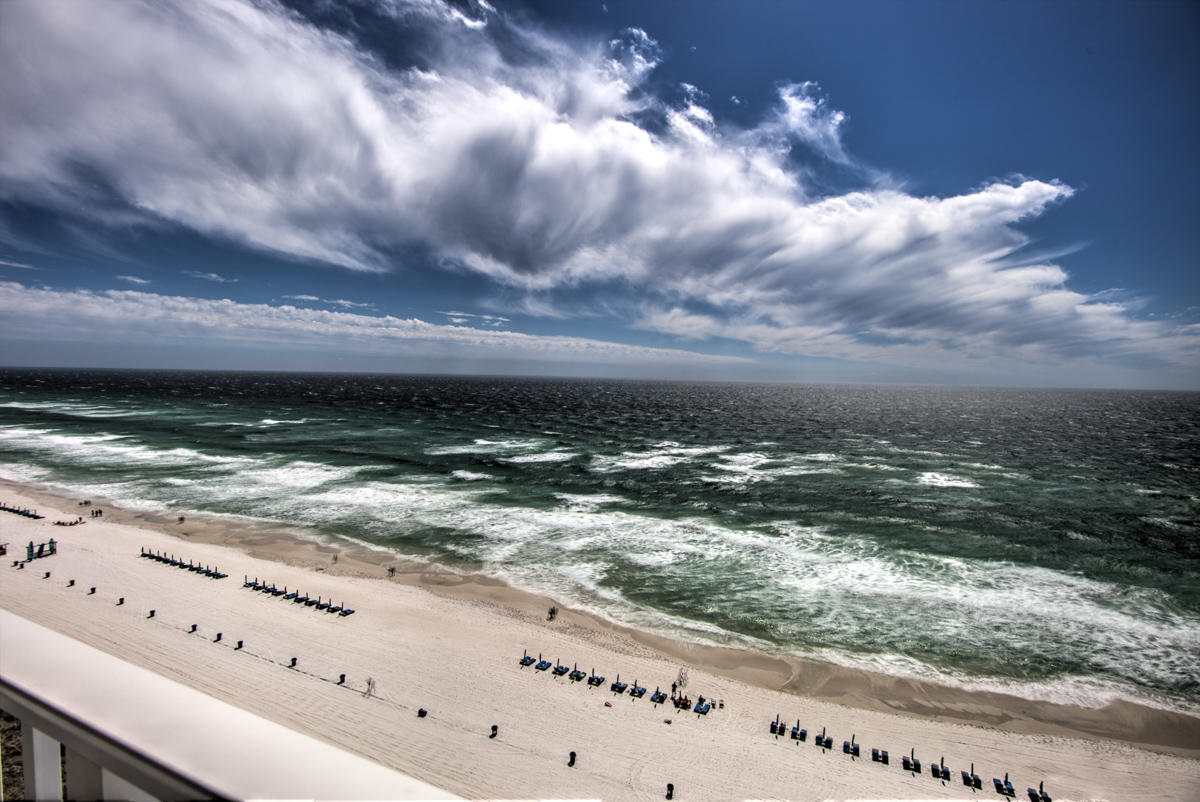RENTAL MACHINE! Stunning beach-chic style adorns this fully-furnished condo with two masters. Relax on your 13th floor XL balcony with only the sound of seagulls and surf, as you watch parasailers and boats in the Gulf. Light and bright throughout with floor to ceiling windows! Recently renovated kitchen with stainless steel appliances and granite countertops, new bathrooms, and new flooring throughout. Long Beach Resort offers a lagoon-style pool overlooking the Gulf, 2 heated pools, pool-side restaurant/bar, fitness room, and more! Turn-key furnishings mean you can move in or start a rental program immediately. Gross rental income for 2016 was $47,338 and 2017 was $49,656! Fees include security, cable, internet, water, sewer, and trash.