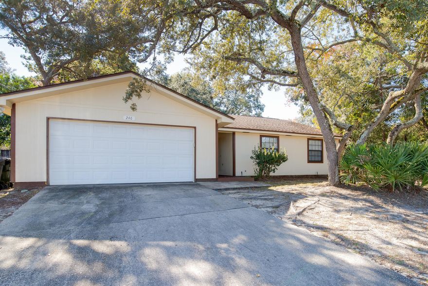 Centrally located 3br/2ba for easy access to all main routes! Open floor plan with high ceilings throughout gives a much larger feel of this cozy, yet spacious home. Interior is well laid out with plenty of storage, fireplace and bar area adjoining the dining area. Spacious screened porch w/ hot tub (as-is) overlook the fully fenced back yard with mature oak trees. Close to bases (~10 min),  beaches, local shopping, and restaurants! Contact listing agent to schedule your showing today! Info deemed accurate, but please verify if desired. Roof 2007, Water heater 2010, HVAC 2010. Hot tub sold as-is.