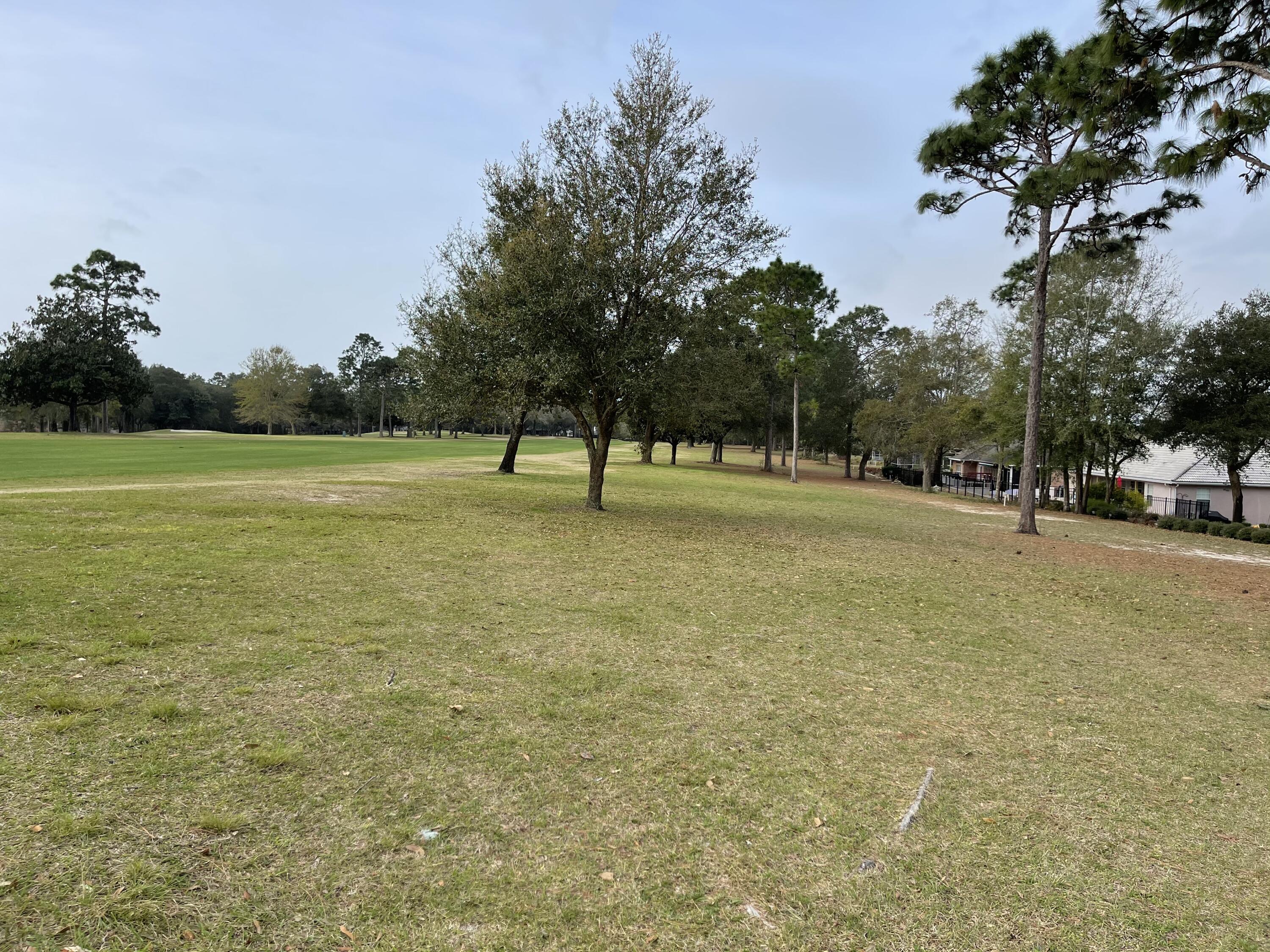 Check it out!! Last remaining vacant lot on the Rocky Bayou Country Club Golf Course. This is a rare opportunity to purchase a vacant lot overlooking the RBCC 17th fairway and hole. With a two-story home you could easily see the lakes on the other side of the green as well as some of the 16th fairway. Another added benefit - lower taxes being zoned in the county!! A spacious 0.34 acre lot provides ample room to build a custom home to take full advantage of the beautiful scenery. Property is on Rocky Bayou Country Club Golf Course, and memberships are available to take advantage of the clubhouse, golf and the pool.