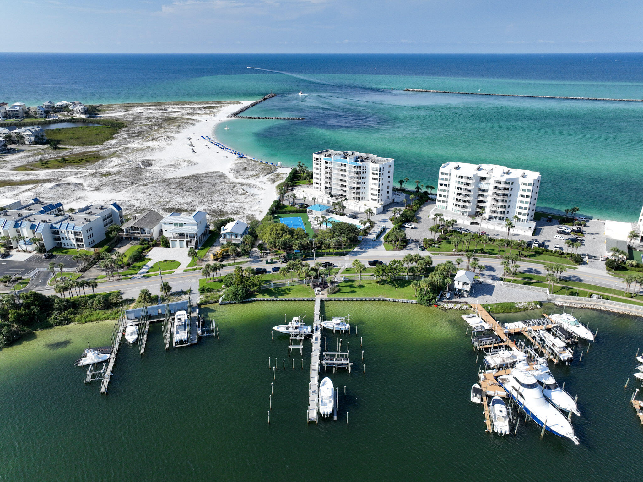 Welcome to the Ultimate a sanctuary where the East Pass and the Gulf of America merge in breathtaking beauty. Just stepping off your private elevator transports you to a realm of unmatched elegance and serenity. As you cross the threshold of this remarkable west-end facing unit, your senses are immediately enveloped in the natural splendor unfurling before you. The panorama is nothing short of spectacular. The vistas of the pass and the shimmering Gulf stretch out like a living masterpiece. Walk outside to one of the two largest waterfront balconies in Destin Fl and watch the dolphins play or enjoy a front row seat to the fireworks show all summer long, every Monday and Thursday. The opposite side of your sanctuary offers a mesmerizing view of Destin Harbor, here both day and night are adorned with stunning views. Watch the sunrise and boats sail across the harbor, once the sun takes its bow, twinkling lights reflect against the gently rippling water, and you hear the music from across the harbor, making you feel even more alive.
This one of a kind completely renovated condominium is a showcase and comes entirely furnished with meticulously selected, top-tier designer furniture throughout. It features quartz countertops, new high-end Cafe' appliances, custom draperies, Lutron electric shades, fresh paint throughout, white marble flooring throughout, brand new hardware, advanced lighting systems, all included in the price.
The Ultimate is an intimate, 21-unit gated, owners only condominium, designed with privacy and luxury in mind, this unit also comes with a private enclosed garage, and a climate-controlled storage unit. The Ultimate features all the amenities' you'd ever need to unwind in style. Dive into the sun-kissed delights of the oversized pool or relax in the hot tub under a canopy of stars. For the active lifestyle, enjoy the newly renovated sports court or hop over to the gym. Unwind further into the sauna or take advantage of the marina right at your fingertips with maintenance staff available to ensure everything is in pristine condition. Secure your spot in paradise and let the magic of Destin come alive!