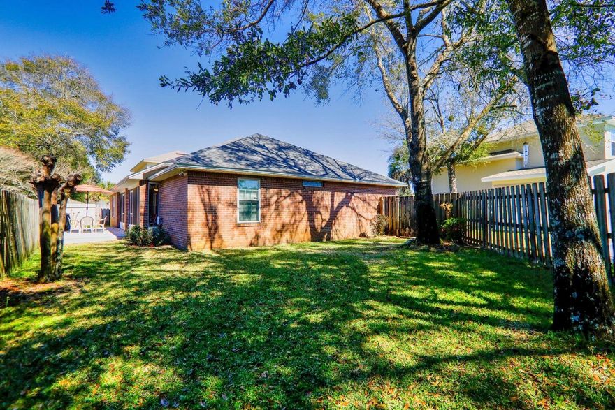 This home is moving ready and in a nice established and well kept neighborhood.  It is located near Fort Walton Golf Course and minutes from Eglin. Well designed home with lots of updates to include but not limited to - new roof 2019, Living areas have hardwood laminate flooring, and bedrooms . The kitchen was previously remodeled with Kraftmaid Hickory Cabinetry, Quartz Counter tops, subway tile on backsplash, stainless steel appliances , sliding glass doors with blinds, all ceiling fans and lighting upgraded, custom fireplace with remote-control gas logs, hurricane impact windows, and more. Split bedroom design. Both baths are updated as well.