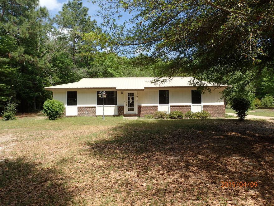Built in 1979, this REO property sits on 1 acre and is just mins North of Airport Rd and schools. Home is all brick construction with metal roof. Inside, some features include tiled floors, decorative ceilings, arched openings, 3 bedrooms 2 baths and indoor laundry. There is a dining area just off the galley style kitchen and over sized living room. This home has tons of potential for both home owner and investor alike.Property being sold subject to HUD Guidelines 24 CFR 206.125.