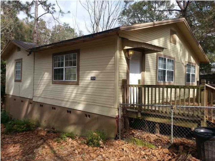Excellent Investment opportunity. Quiet area. Single story home on large corner lot. Plenty of trees, and fenced in back yard for privacy. Real wood floors, beautiful solid Pine paneled walls (like in a mountain cabin). back porch. high elevation. (appliances are not warranted - Seller has no knowledge of working condition)