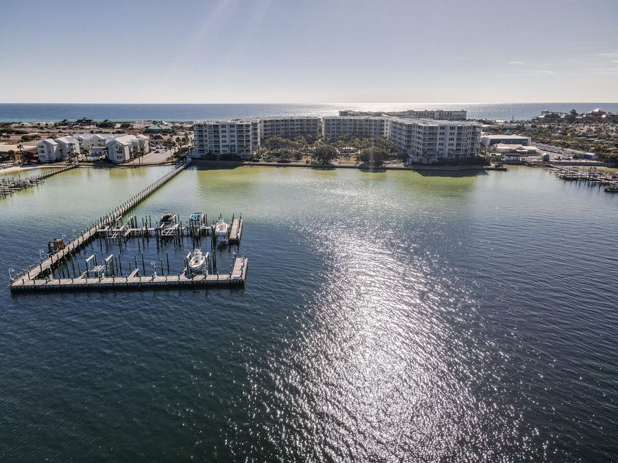 Capture your private little piece of paradise in 2023 with this turn-key condo AND BOAT Slip. This Vacation Condo shows pride of ownership through timely and professional maintenance and management. This unit is offered furnished and with everything needed to add it to your rental portfolio today. The unit boasts an open floor plan featuring three bedrooms.  Enjoy accessing the extra large waterview balcony from the living area and the main bedroom. The complex offers a host of recreational opportunities including beach AND bay access. Or spend the day relaxing in the lazy river. The seller will participate in a 1031 exchange timeline and requests the same of the buyer. This unit is on the rental market and will require a showing appointment. Virtual Walk-Through available in the images.