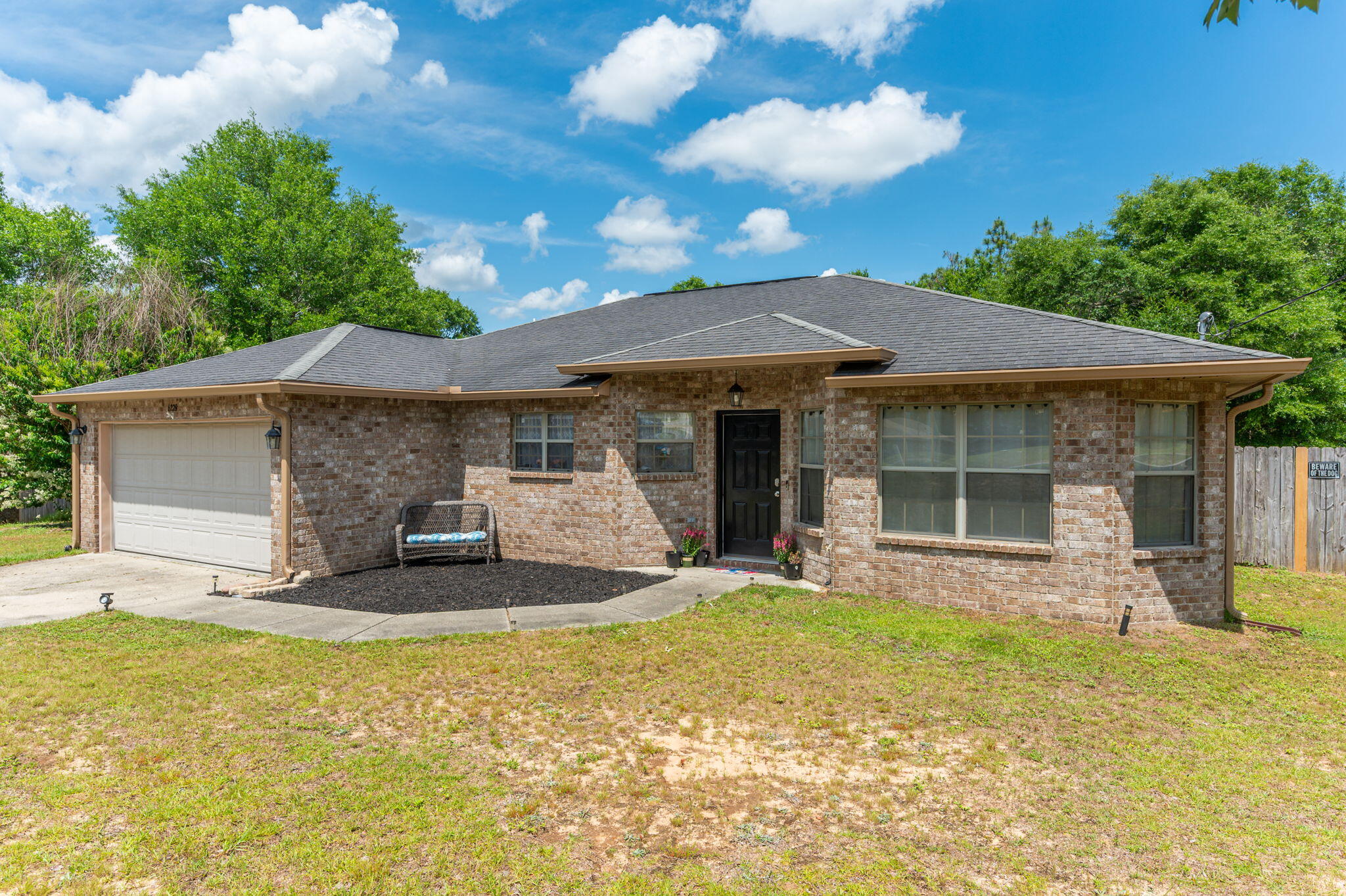~UPDATE~ Washer & Dryer included in the sale. Welcome home to Silver Springs Estates! Situated on over a half-acre lot, tucked away in a peaceful cul-de-sac, this all-brick 3 bedroom, 2 bath home has the perfect bonus room ready to be utilized for whatever you need! Step inside to discover luxury vinyl plank (LVP) flooring that runs throughout the main living spaces--stylish, durable, and easy to maintain.The kitchen features granite countertops, center island, pantry & stainless-steel appliances. Recent upgrades include a brand-new water heater and new rain gutters, providing added peace of mind and efficiency. Out back, enjoy your own private oasis with a fully fenced backyard perfect for pets, play, gardening, or entertaining guests. Whether you're hosting summer barbecues or enjoying a quiet evening, this outdoor space is ready for your lifestyle.