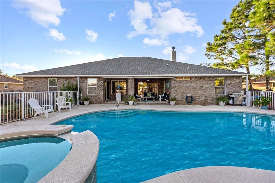 Welcome to this beautiful and spacious 4-bedroom, 3-bathroom home offering the perfect blend of comfort, functionality and Florida living. Tucked on a nearly .5 acre lot in the desirable Holly by the Sea community, this home features a thoughtful split floor plan, dedicated office, formal dining room, and a cozy breakfast nook overlooking the pool and patio.One of the bedrooms includes its own private lockout option--ideal for guests, multigenerational living, or even rental income. This suite has private bathroom access and opens directly to the pool area, creating a true retreat. The primary suite also enjoys private pool access, offering a seamless indoor-outdoor lifestyle. The kitchen is a chef's delight, offering stainless steel appliances, granite. Re-Roof 2019