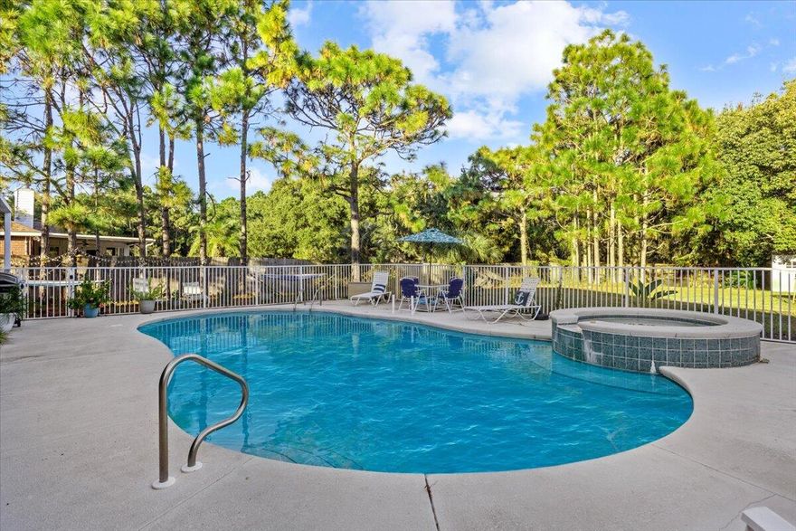 Welcome to this beautiful and spacious 4-bedroom, 3-bathroom home offering the perfect blend of comfort, functionality and Florida living. Tucked on a nearly .5 acre lot in the desirable Holly by the Sea community, this home features a thoughtful split floor plan, dedicated office, formal dining room, and a cozy breakfast nook overlooking the pool and patio.One of the bedrooms includes its own private lockout option--ideal for guests, multigenerational living, or even rental income. This suite has private bathroom access and opens directly to the pool area, creating a true retreat. The primary suite also enjoys private pool access, offering a seamless indoor-outdoor lifestyle. The kitchen is a chef's delight, offering stainless steel appliances, granite. Re-Roof 2019