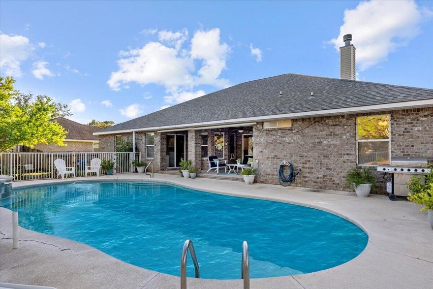 Welcome to this beautiful and spacious 4-bedroom, 3-bathroom home offering the perfect blend of comfort, functionality and Florida living. Tucked on a nearly .5 acre lot in the desirable Holly by the Sea community, this home features a thoughtful split floor plan, dedicated office, formal dining room, and a cozy breakfast nook overlooking the pool and patio.One of the bedrooms includes its own private lockout option--ideal for guests, multigenerational living, or even rental income. This suite has private bathroom access and opens directly to the pool area, creating a true retreat. The primary suite also enjoys private pool access, offering a seamless indoor-outdoor lifestyle. The kitchen is a chef's delight, offering stainless steel appliances, granite. Re-Roof 2019