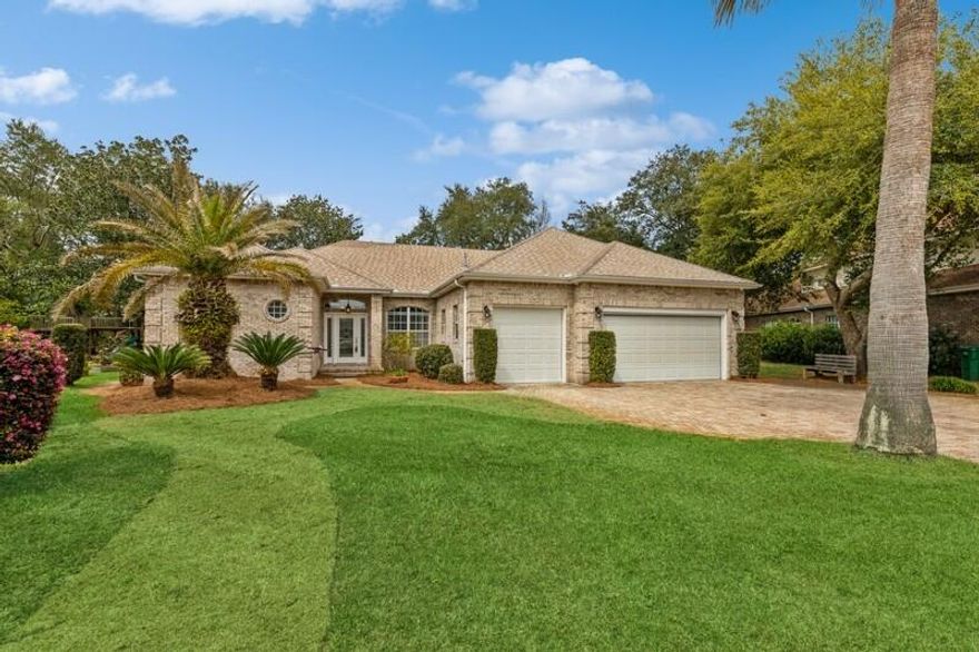 Magnolia Plantation Gem! This exceptional home offers a unique, custom design with a spacious open floor plan located in one of Bluewater Bay's exclusive gated communities. Ideal for hosting guests, it features soaring 10 and 11-foot ceilings, granite countertops, stainless-steel kitchen appliances, and a sizable bar/center island for added convenience. The residence boasts an abundance of natural light, with sliding glass pocket doors encircling the home, providing stunning views of the natural surroundings and creating a sense of openness. The kitchen pantry has been cleverly converted into hidden steps leading to a finished attic/playroom/movie theater, adding an additional 300 square feet of living space. Close to a marina, state park, shopping and dining.