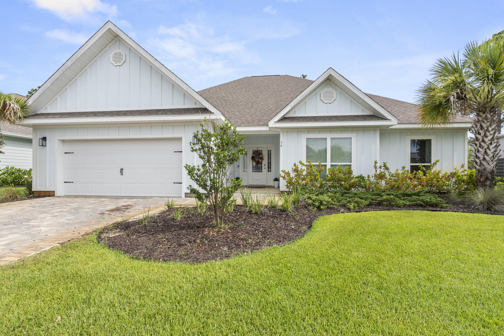 Seller is offering a $8,000.00 credit at closing towards buyers closing costs on this 5-bed, 3-bath home is located just south of Highway 98, a mere 1.2 miles from public beach access on 30A. The home boasts elegant 9' ceilings, sleek countertops, shaker style cabinetry, and EVP flooring throughout, with carpet in three of the five bedrooms. Tray ceilings with crown molding adorn the foyer, dining room, family room, and primary bedroom. The primary bedroom, situated just off the family room, features two spacious walk-in closets and a bath with dual sinks, a fiberglass tub, and a separate tile shower. The private yard backs up to a nature preserve, offering quick access to the trail leading to nearby Helen McCall Park. When you're not at the beach, you can cool off in the large neighborhood pool within the lovely gated community of Lakeview Estates