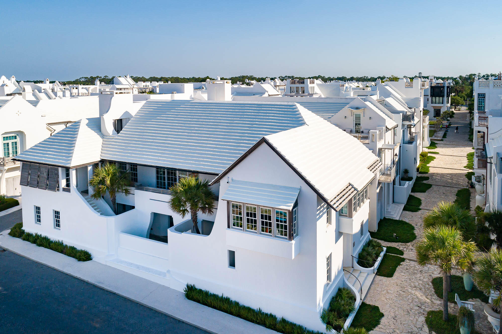 Starr Sanford Design tastefully created an Alys Beach masterpiece found in 6 Shinbone Court.  This premier bookend home is cornered on Sea Garden Street and the Sea Garden Walk Pedestrian Path roughly 75 yards to the Sea Garden beach access.Gulf of Mexico water views add to the ambiance of this tasteful design by Starr Sanford who created furnishings to compliment the home & the Alys Beach lifestyle.  The main living areas carry whitewashed Oak vaulted ceilings with sliding doors allowing Gulf breezes to flow added with a statement fireplace defining the room.  6 Shinbone Court boasts 4,613 square feet of conditioned living space, which does not include for the designated areas of balconies & terraces.  4 guest bedrooms align the 1st level opening to the courtyard loggia & pool with